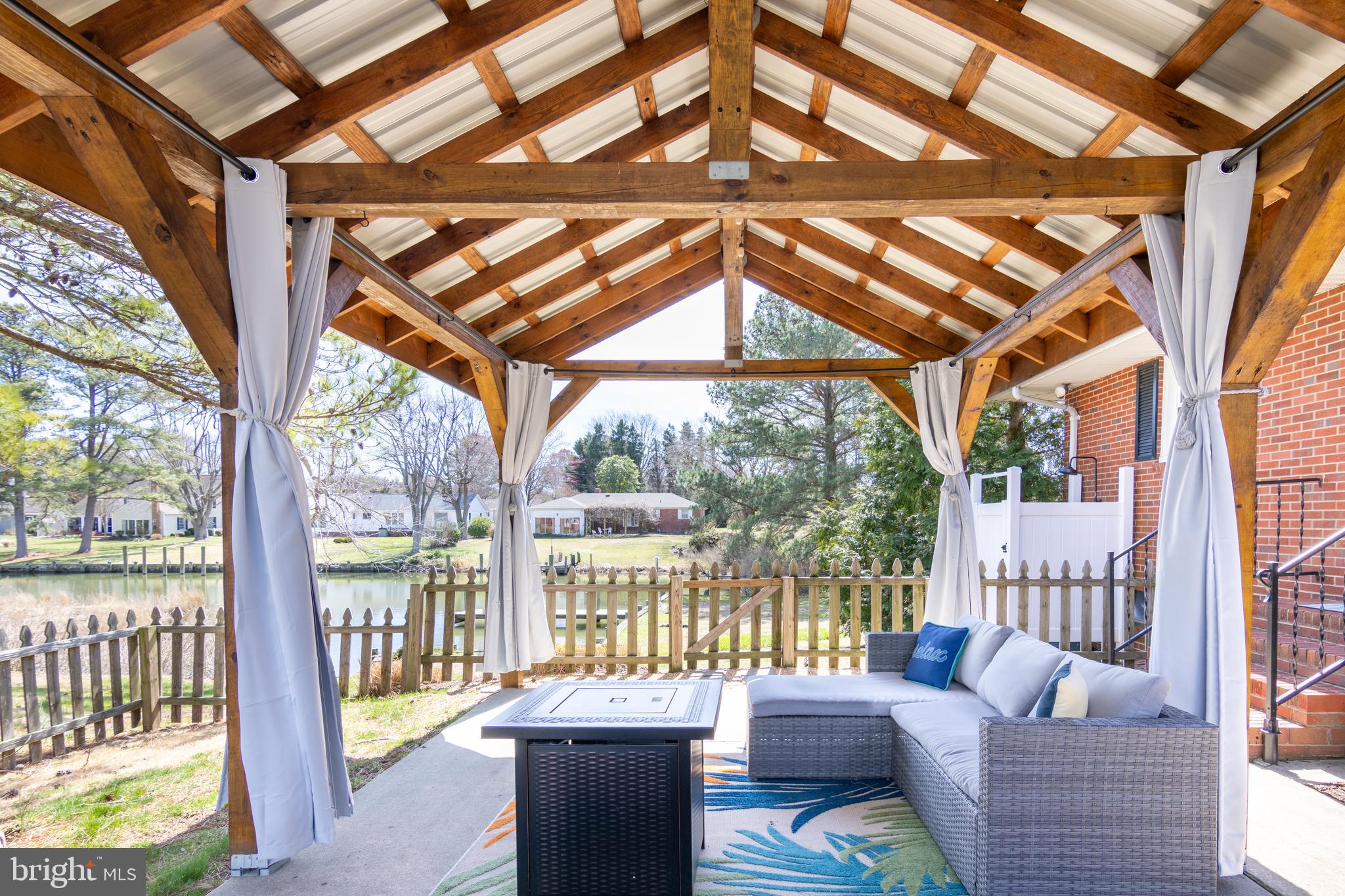 5505 Whitehall Road Cambridge, MD 21613 - Photo 26 of 44 a living room with furniture and a yard