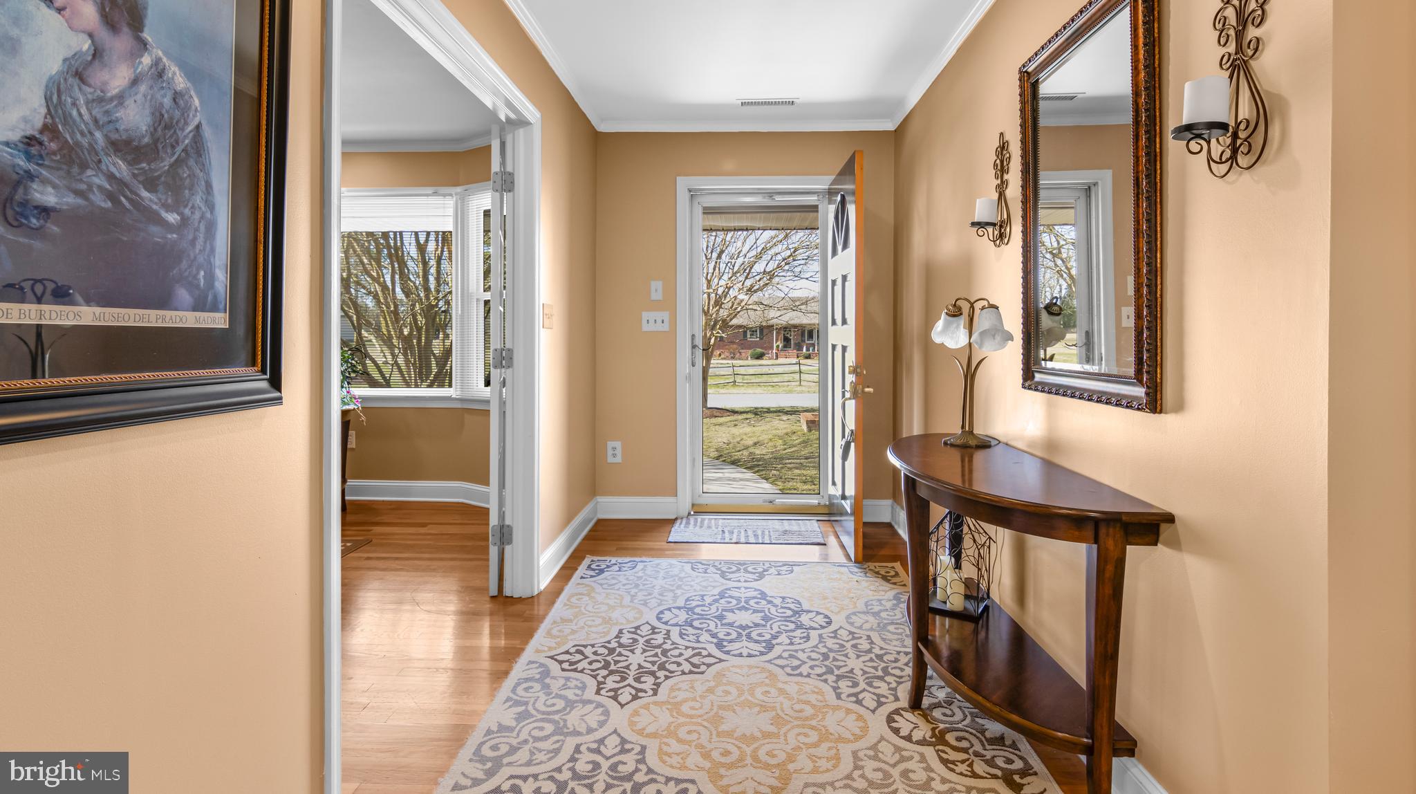 5505 Whitehall Road Cambridge, MD 21613 - Photo 3 of 44 a view of a hallway with wooden floor and windows