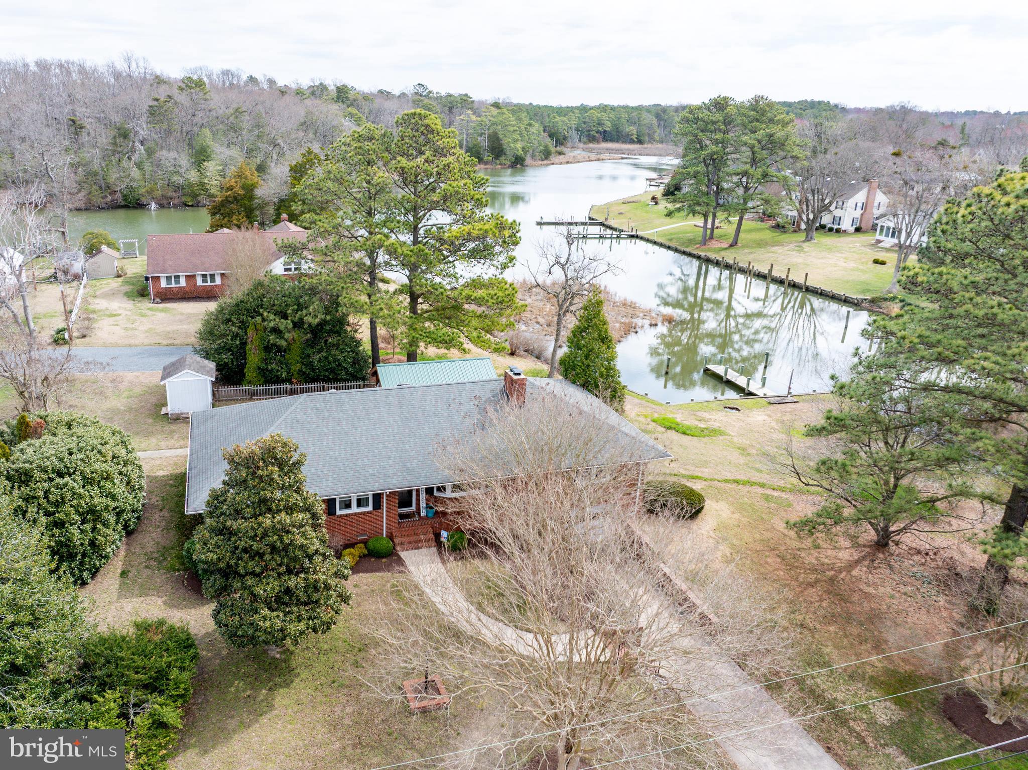 5505 Whitehall Road Cambridge, MD 21613 - Photo 31 of 44 an aerial view of a house with a yard and lake view
