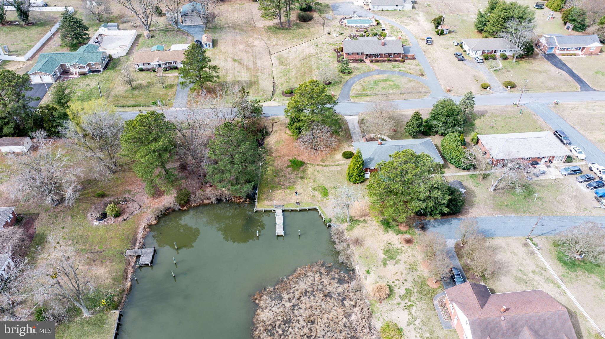 5505 Whitehall Road Cambridge, MD 21613 - Photo 37 of 44 an aerial view of a house with a yard swimming pool and outdoor seating