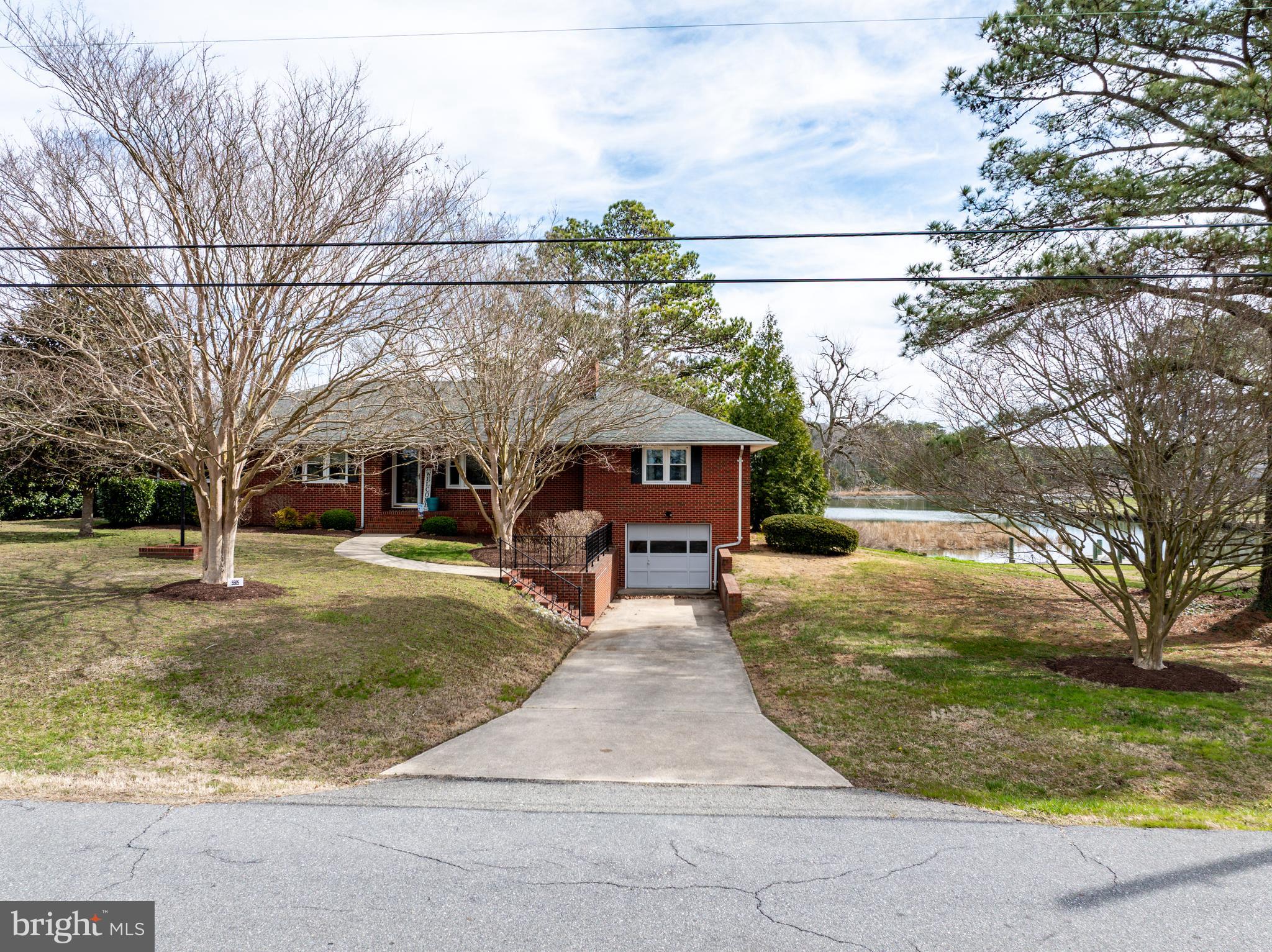 5505 Whitehall Road Cambridge, MD 21613 - Photo 43 of 44 a view of a yard with a house in the background