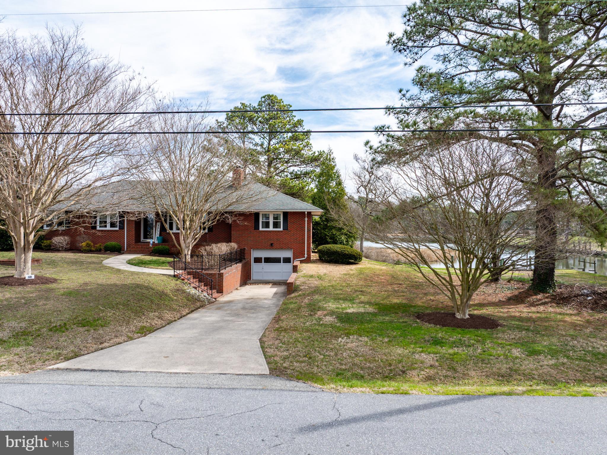 5505 Whitehall Road Cambridge, MD 21613 - Photo 44 of 44 a view of a yard in front of a house