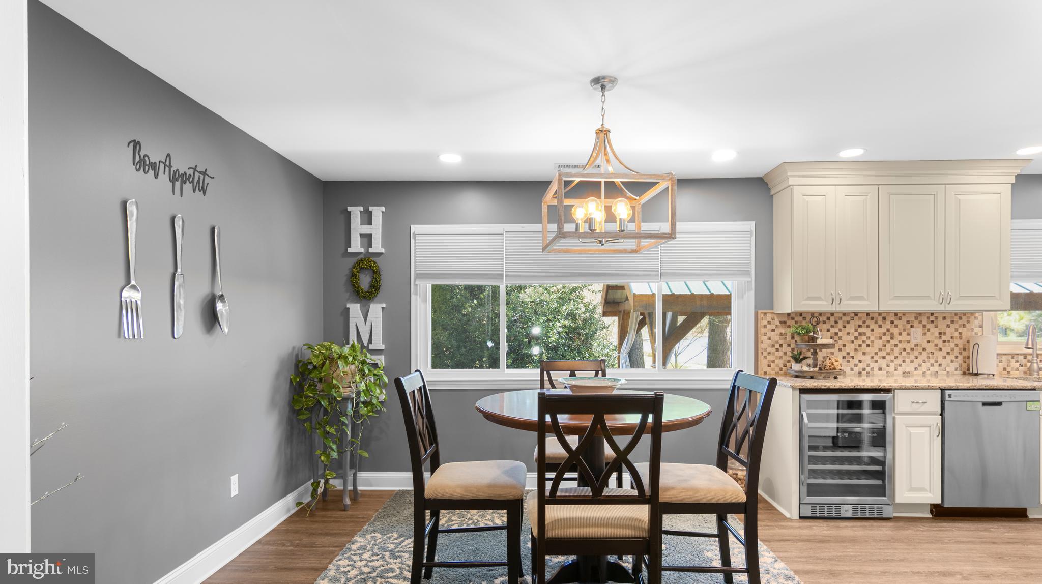 5505 Whitehall Road Cambridge, MD 21613 - Photo 7 of 44 a view of a dining room with furniture window and wooden floor