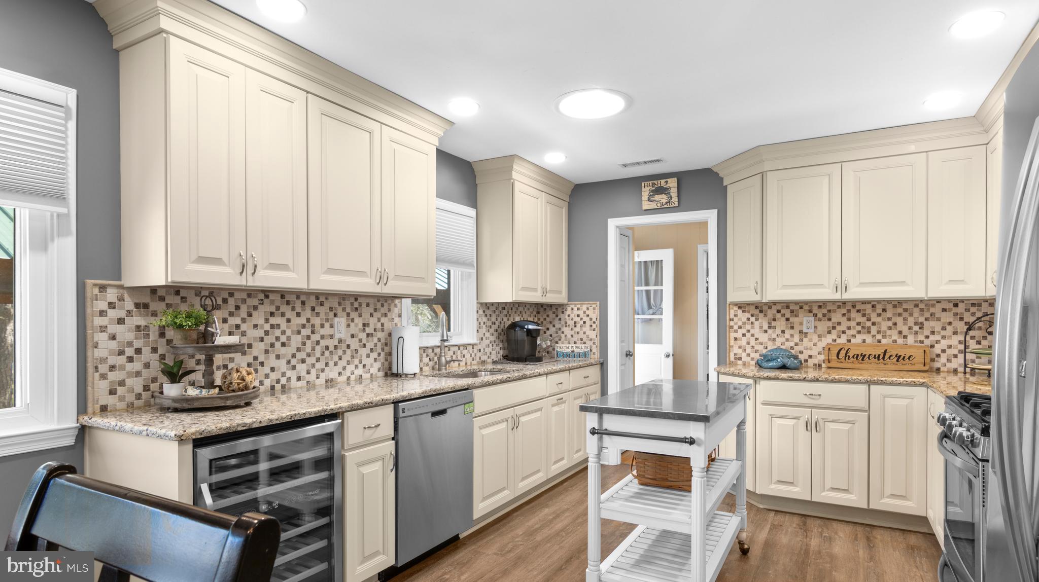 5505 Whitehall Road Cambridge, MD 21613 - Photo 9 of 44 a kitchen with white cabinets and white appliances