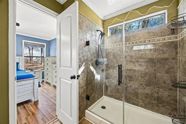 a bedroom with bed and a window