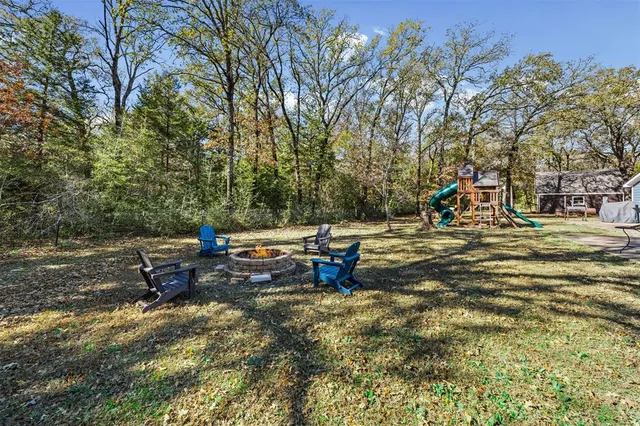 a house with swimming pool in front of it