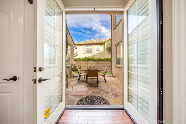 a view of living room with a fireplace and a table next to a window
