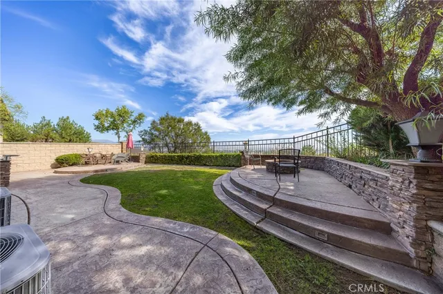 a view of a backyard with sitting area