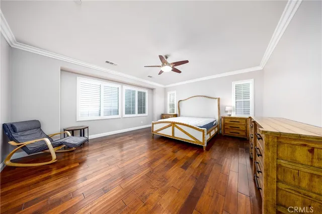 a bedroom with bed and window