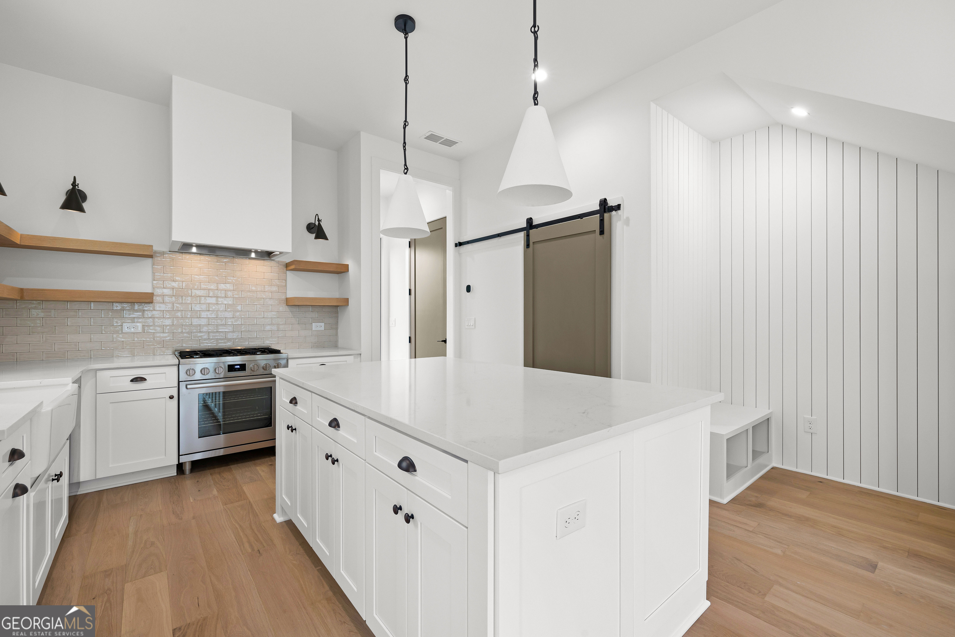 225 Rolison Way Fayetteville, GA 30214 - Photo 11 of 46 a kitchen with stainless steel appliances a stove a sink and a refrigerator