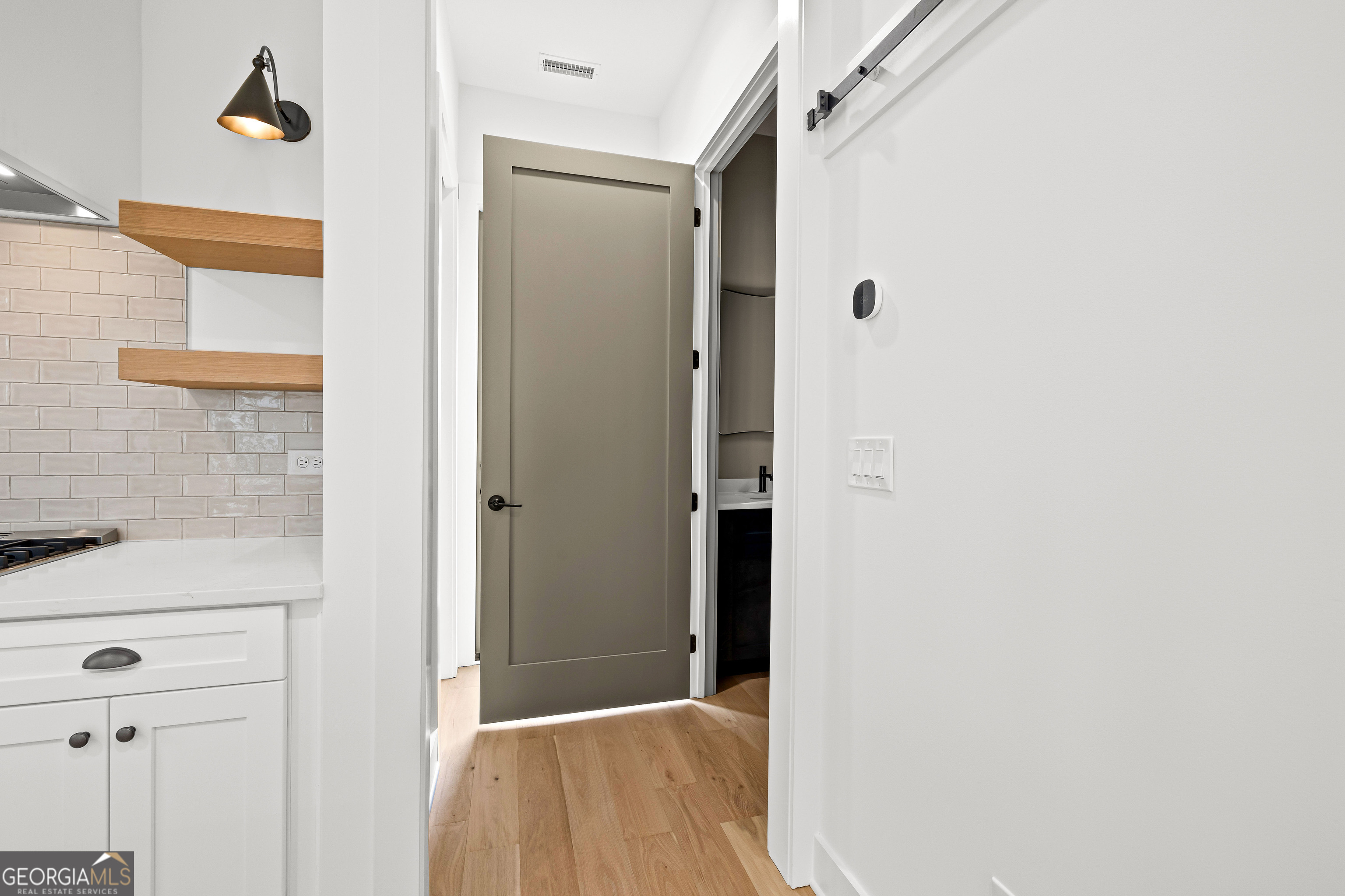 225 Rolison Way Fayetteville, GA 30214 - Photo 16 of 46 a view of a hallway with wooden floor