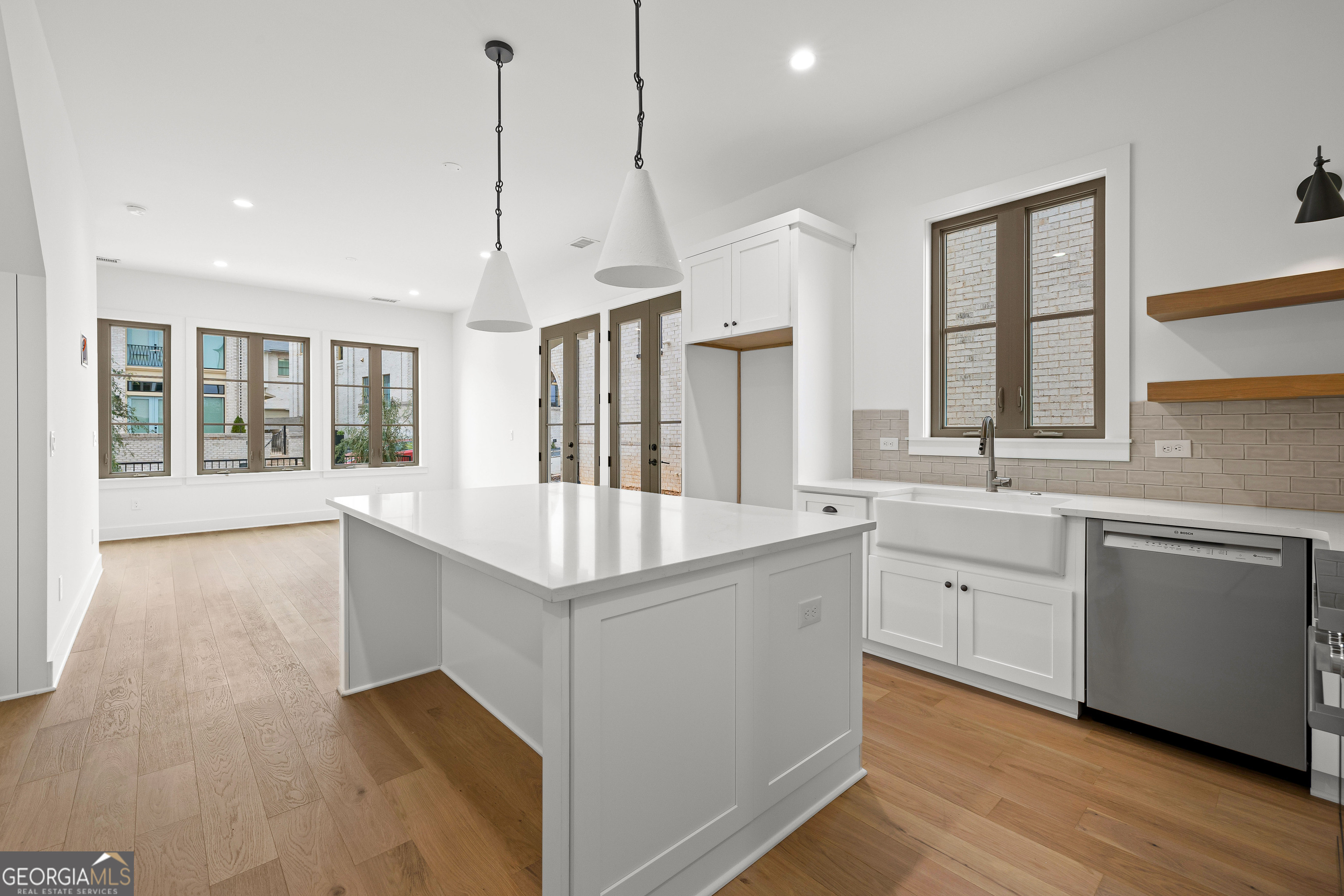 225 Rolison Way Fayetteville, GA 30214 - Photo 18 of 46 a kitchen with stainless steel appliances granite countertop a sink a window and a counter top space