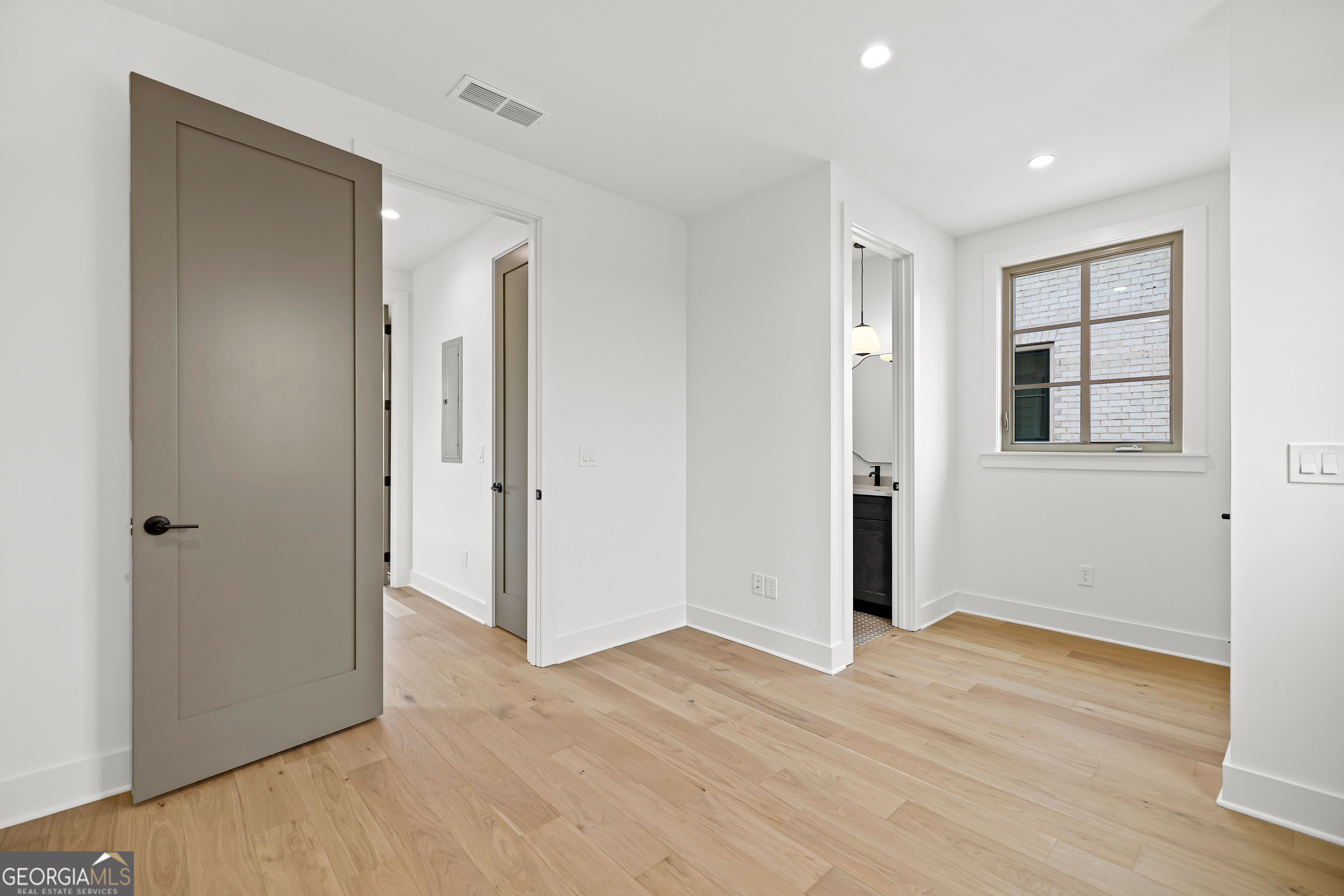 225 Rolison Way Fayetteville, GA 30214 - Photo 25 of 46 a view of an empty room with wooden floor and a window
