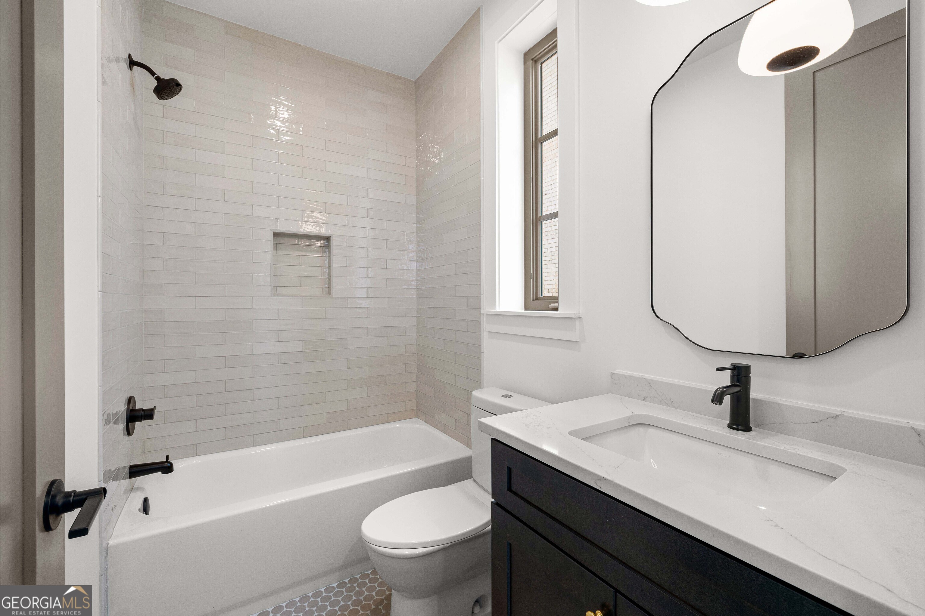 225 Rolison Way Fayetteville, GA 30214 - Photo 26 of 46 a bathroom with a granite countertop sink a toilet and bathtub