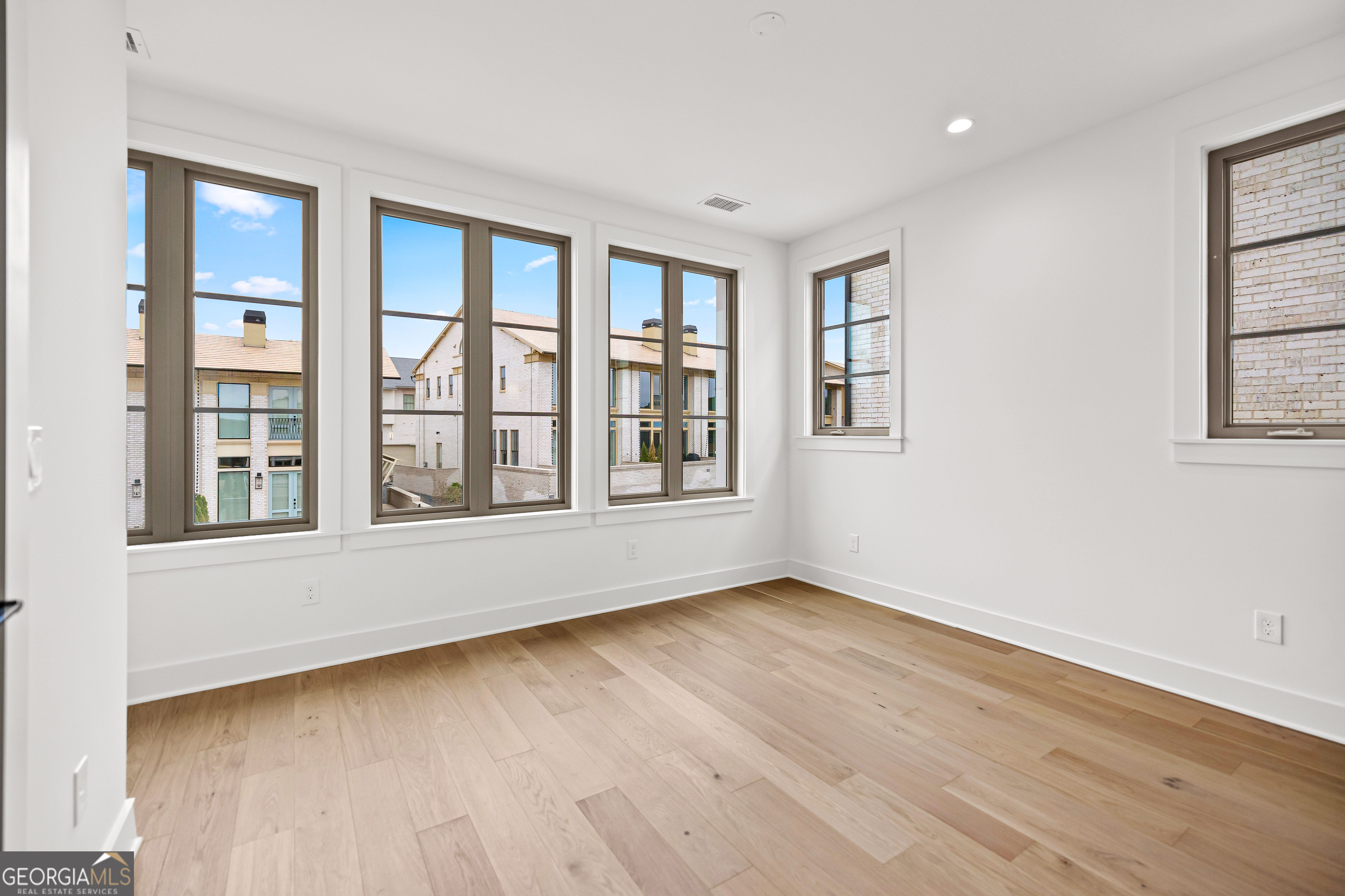 225 Rolison Way Fayetteville, GA 30214 - Photo 28 of 46 a view of an empty room with a window and wooden floor