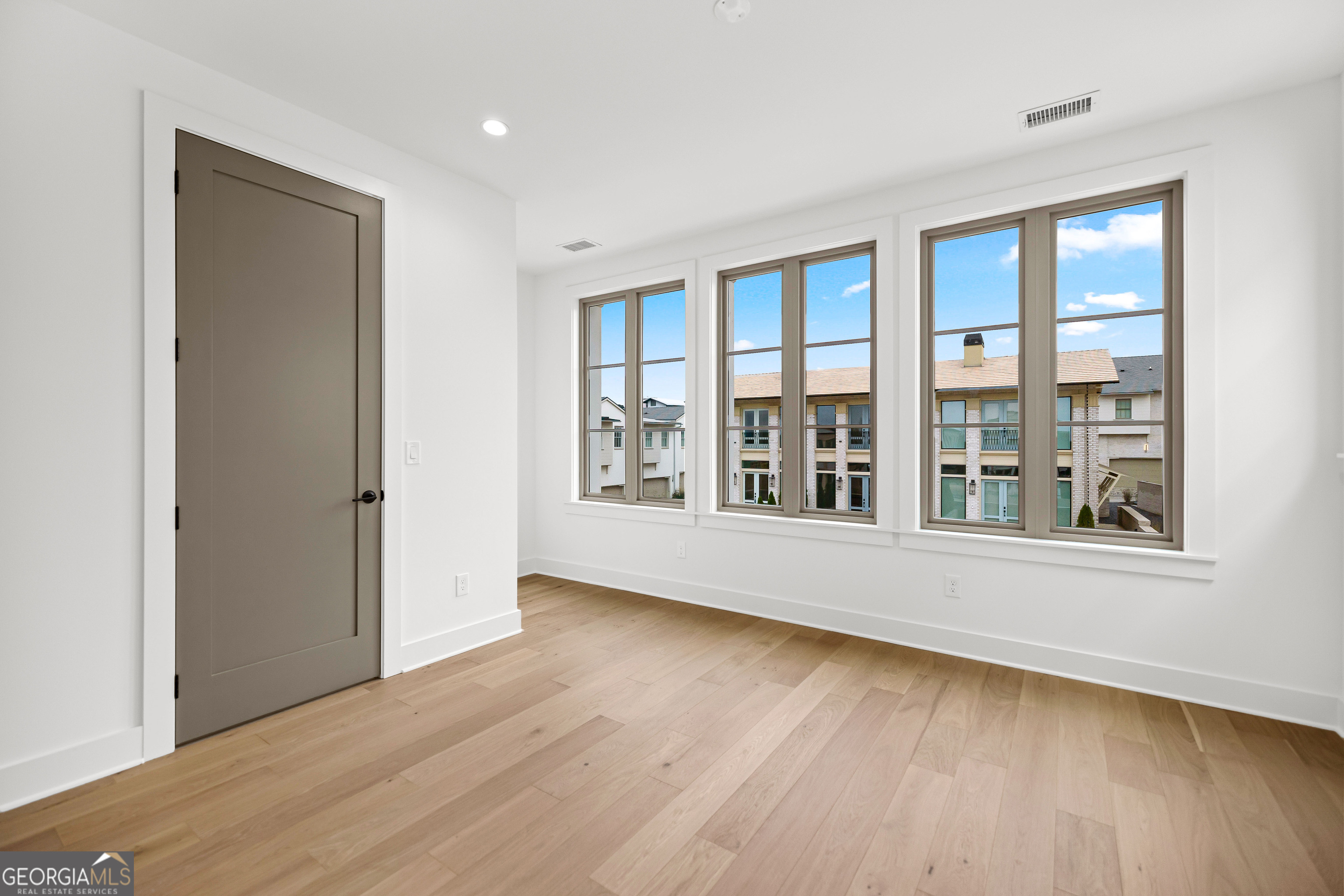 225 Rolison Way Fayetteville, GA 30214 - Photo 29 of 46 a view of an empty room with wooden floor and a window