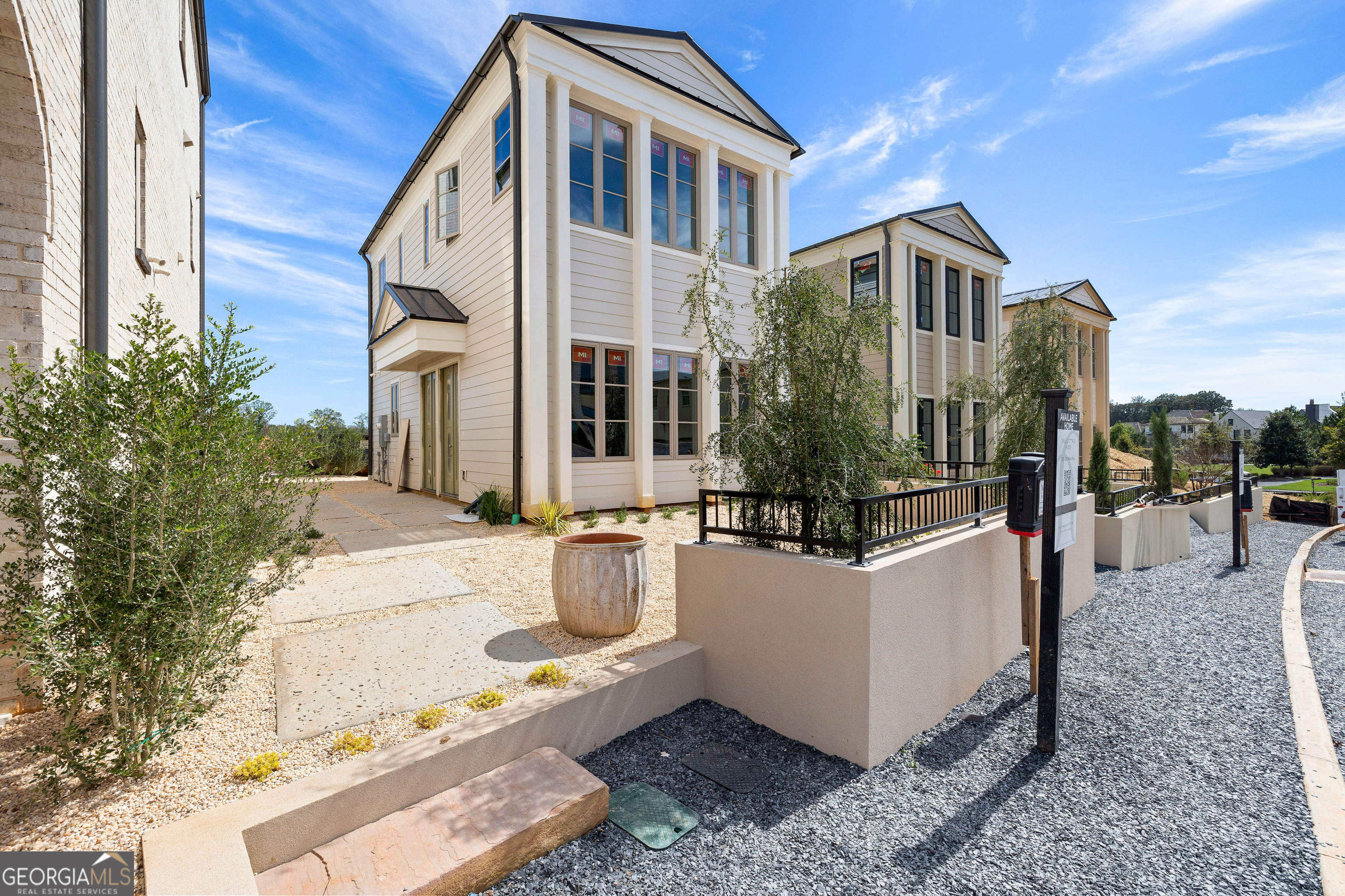 225 Rolison Way Fayetteville, GA 30214 - Photo 3 of 46 a view of a white building among the house with outdoor seating