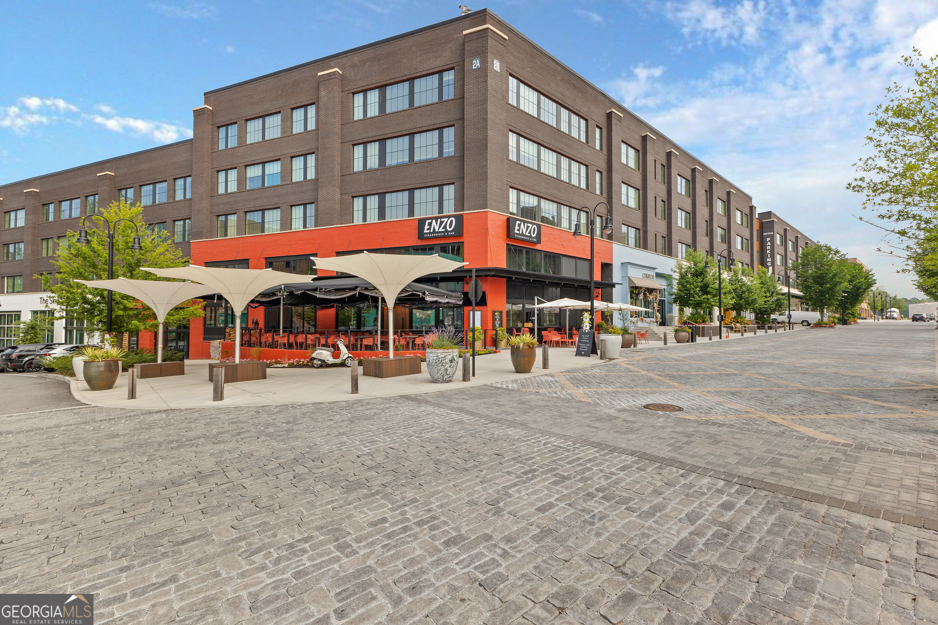 225 Rolison Way Fayetteville, GA 30214 - Photo 39 of 46 a group of people sitting outside of a building