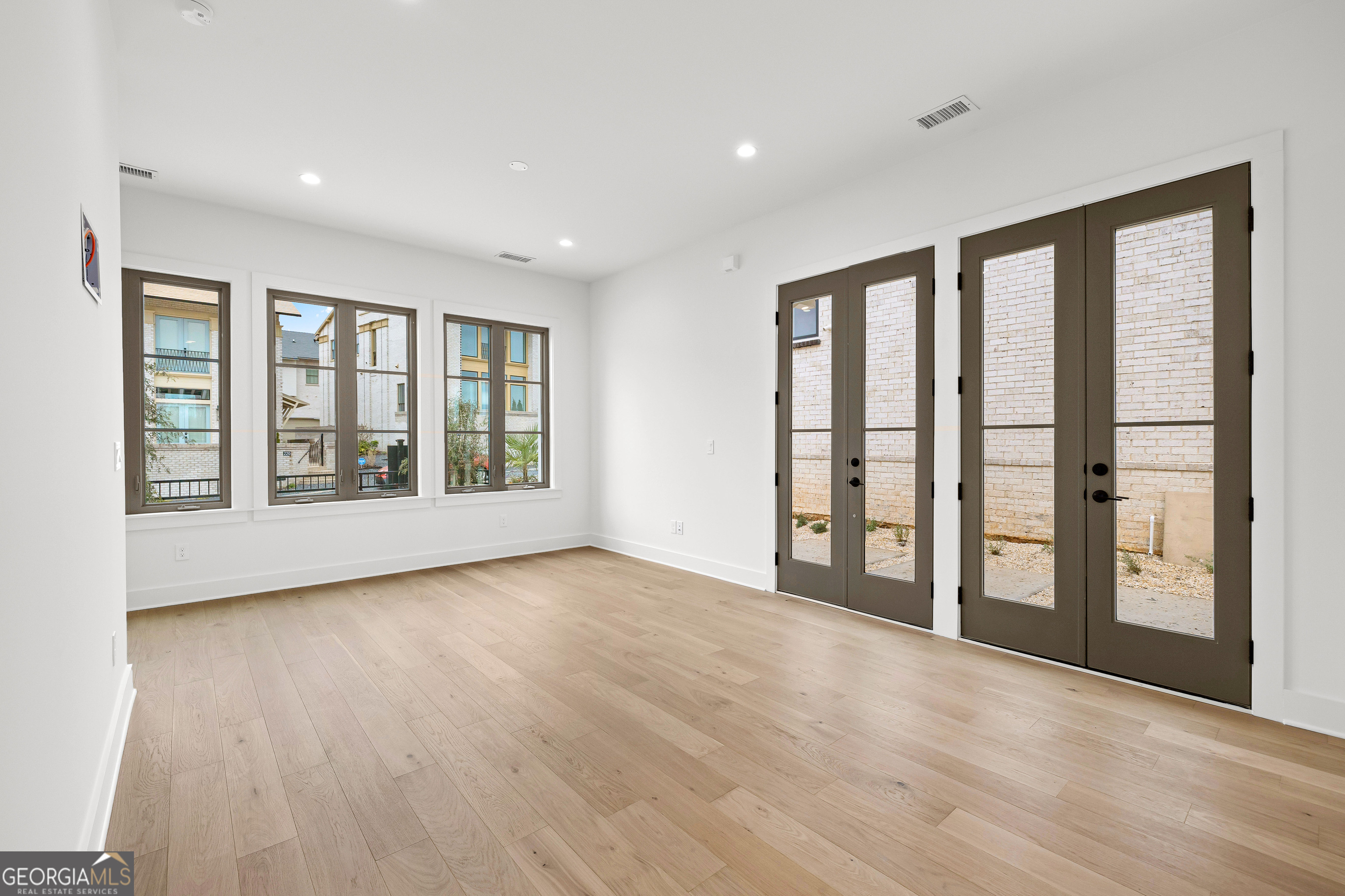 225 Rolison Way Fayetteville, GA 30214 - Photo 6 of 46 a view of an empty room with glass door and balcony