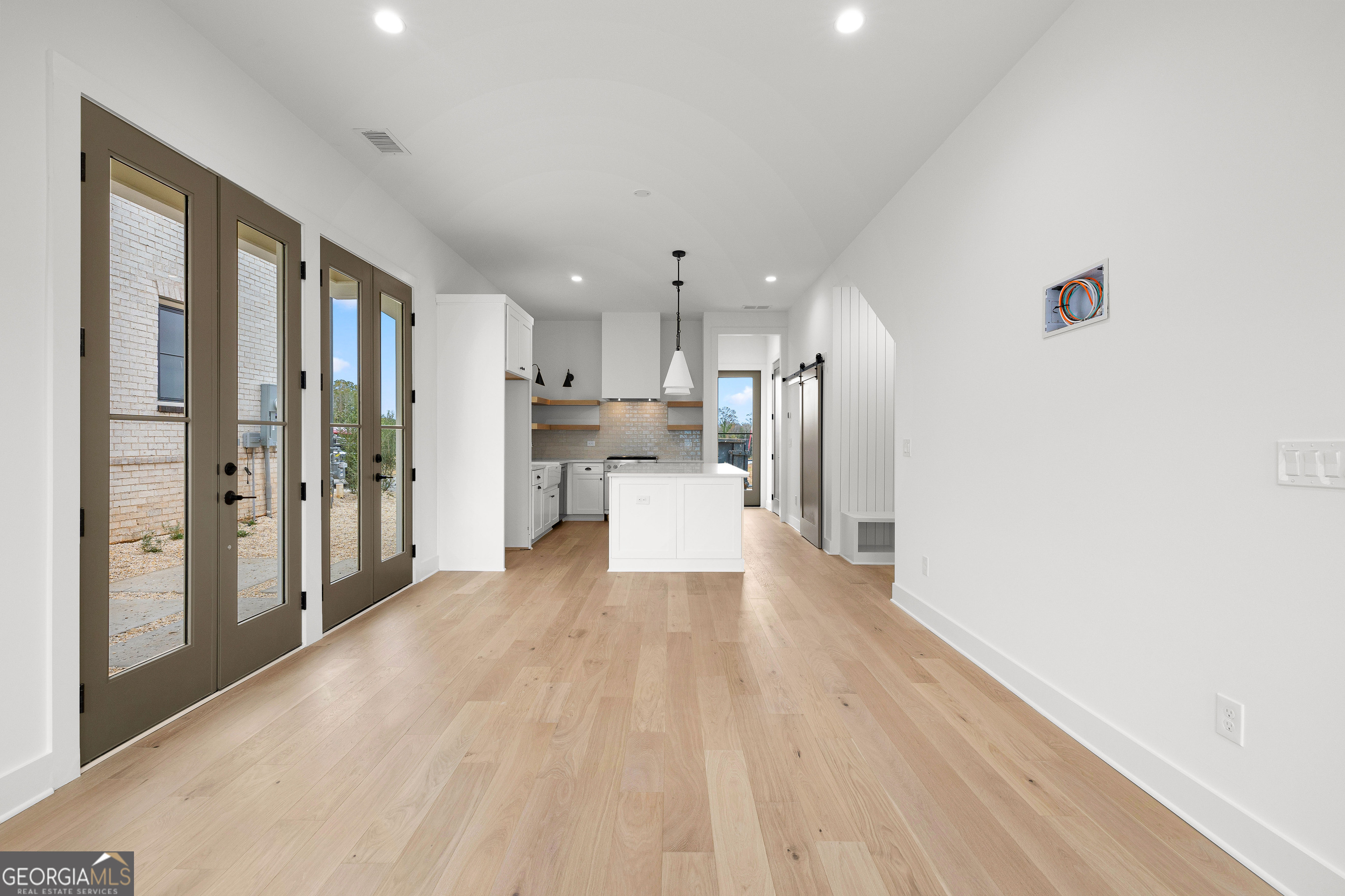 225 Rolison Way Fayetteville, GA 30214 - Photo 9 of 46 a view of a kitchen with wooden floor and a kitchen