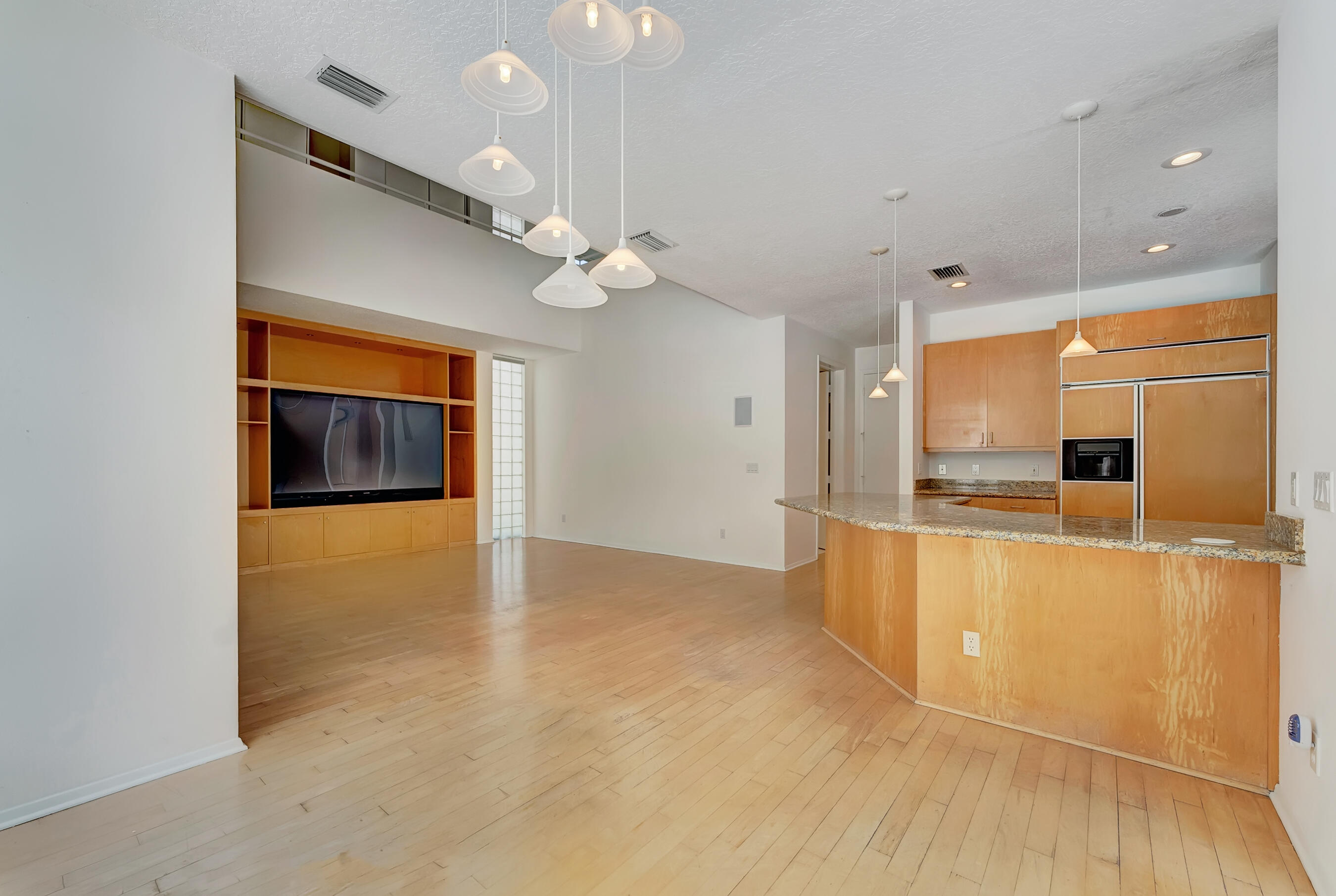 114 Olympus Circle Jupiter, FL 33477 - Photo 20 of 88 a view of a kitchen with a sink and a refrigerator