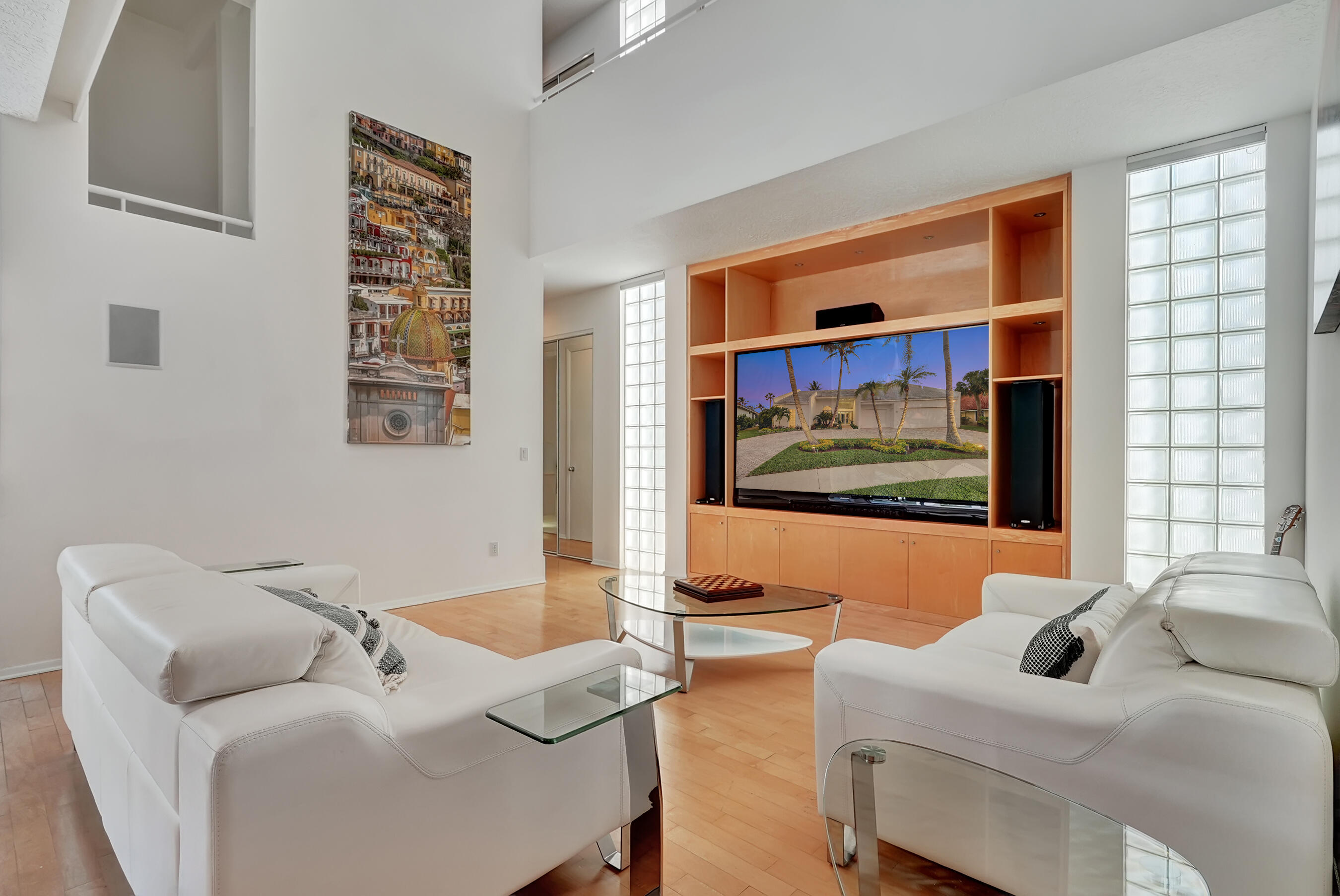 114 Olympus Circle Jupiter, FL 33477 - Photo 25 of 88 a living room with furniture and a flat screen tv