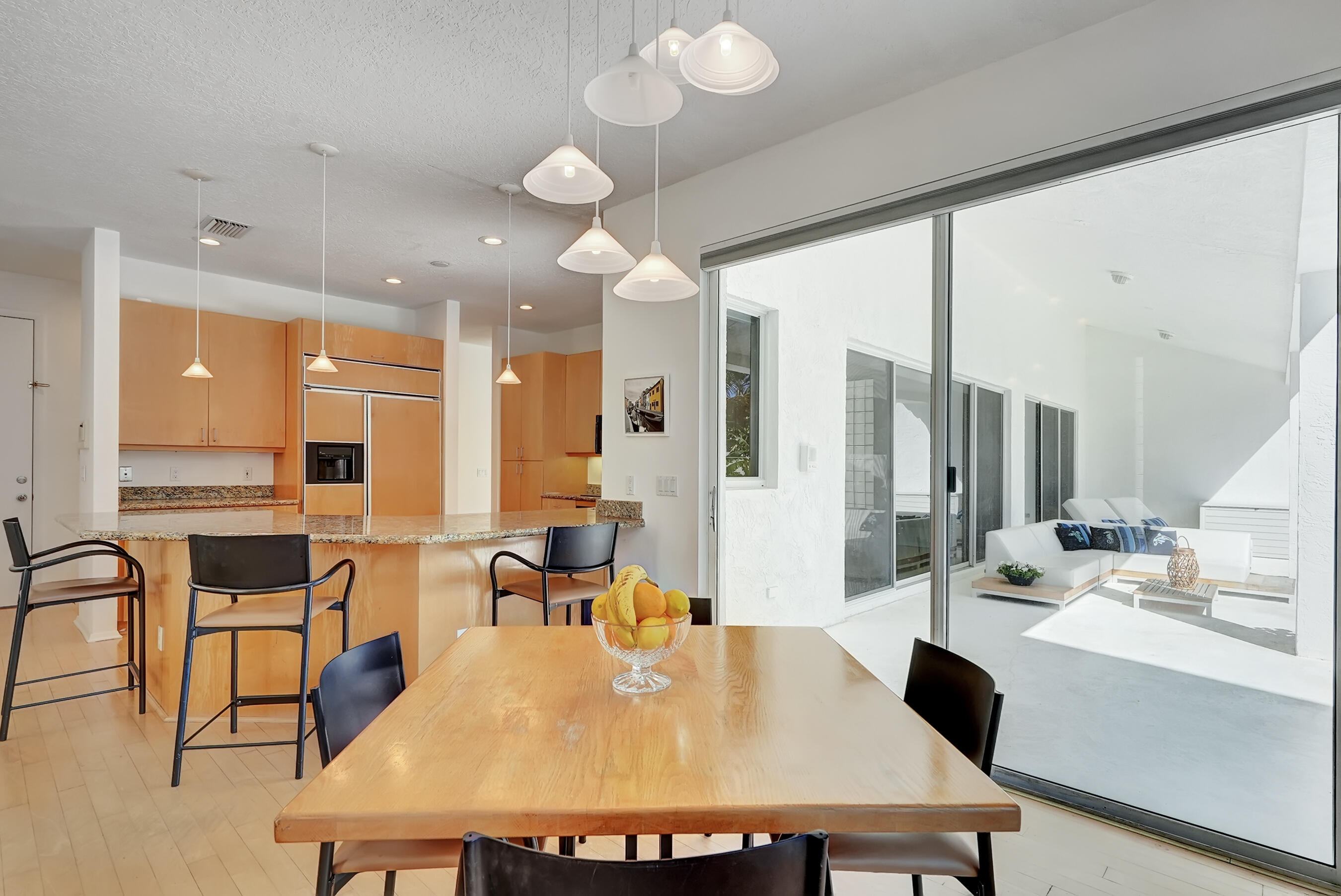 114 Olympus Circle Jupiter, FL 33477 - Photo 28 of 88 a large kitchen with a table and chairs