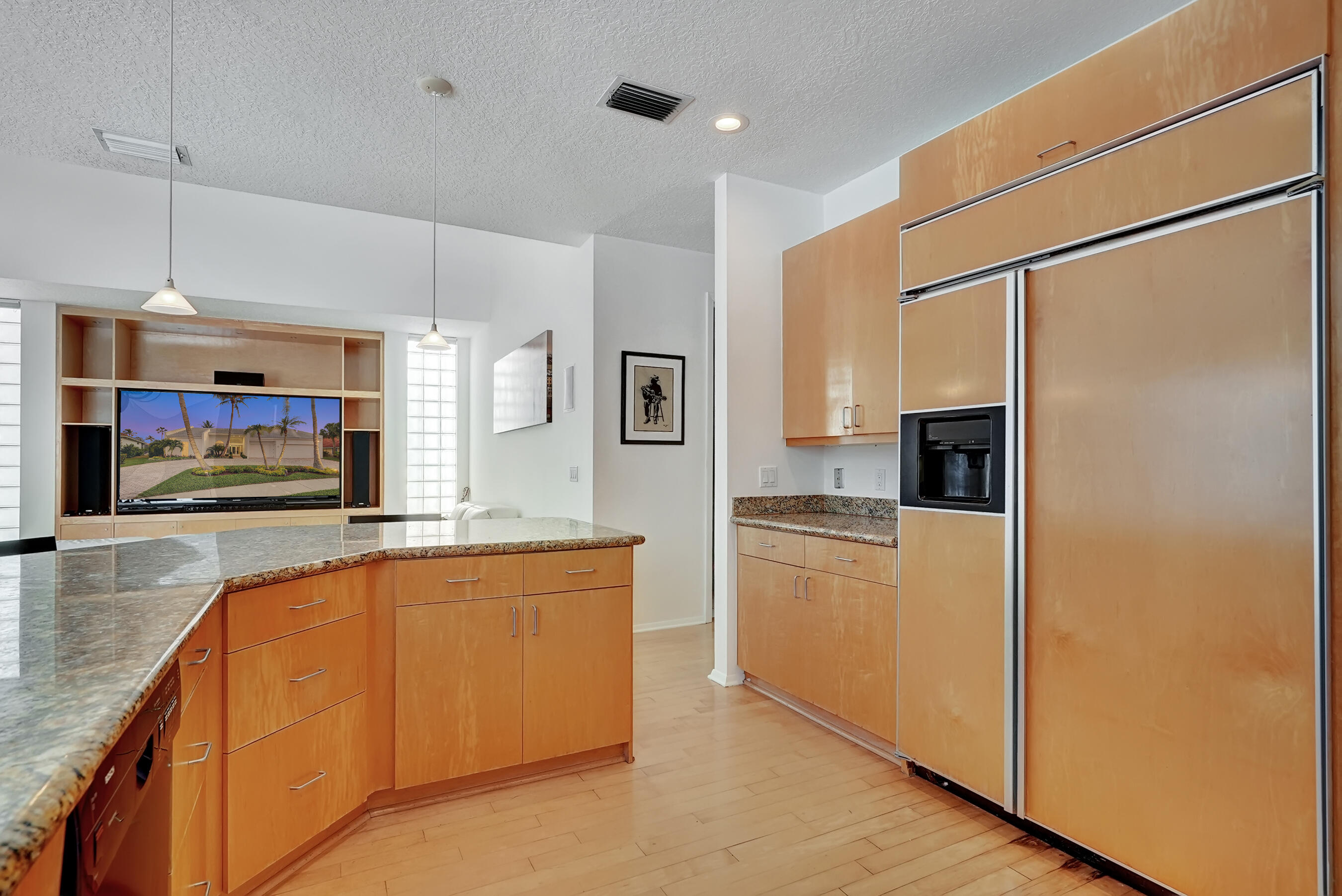 114 Olympus Circle Jupiter, FL 33477 - Photo 30 of 88 a kitchen with stainless steel appliances granite countertop a refrigerator a stove and a sink