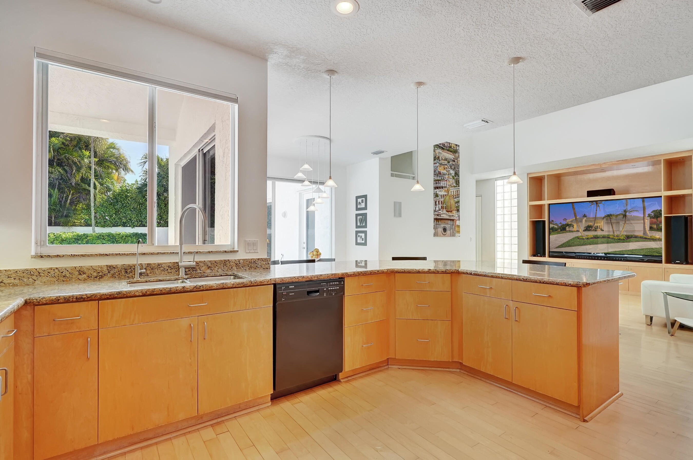 114 Olympus Circle Jupiter, FL 33477 - Photo 31 of 88 a large kitchen with granite countertop a stove and a sink