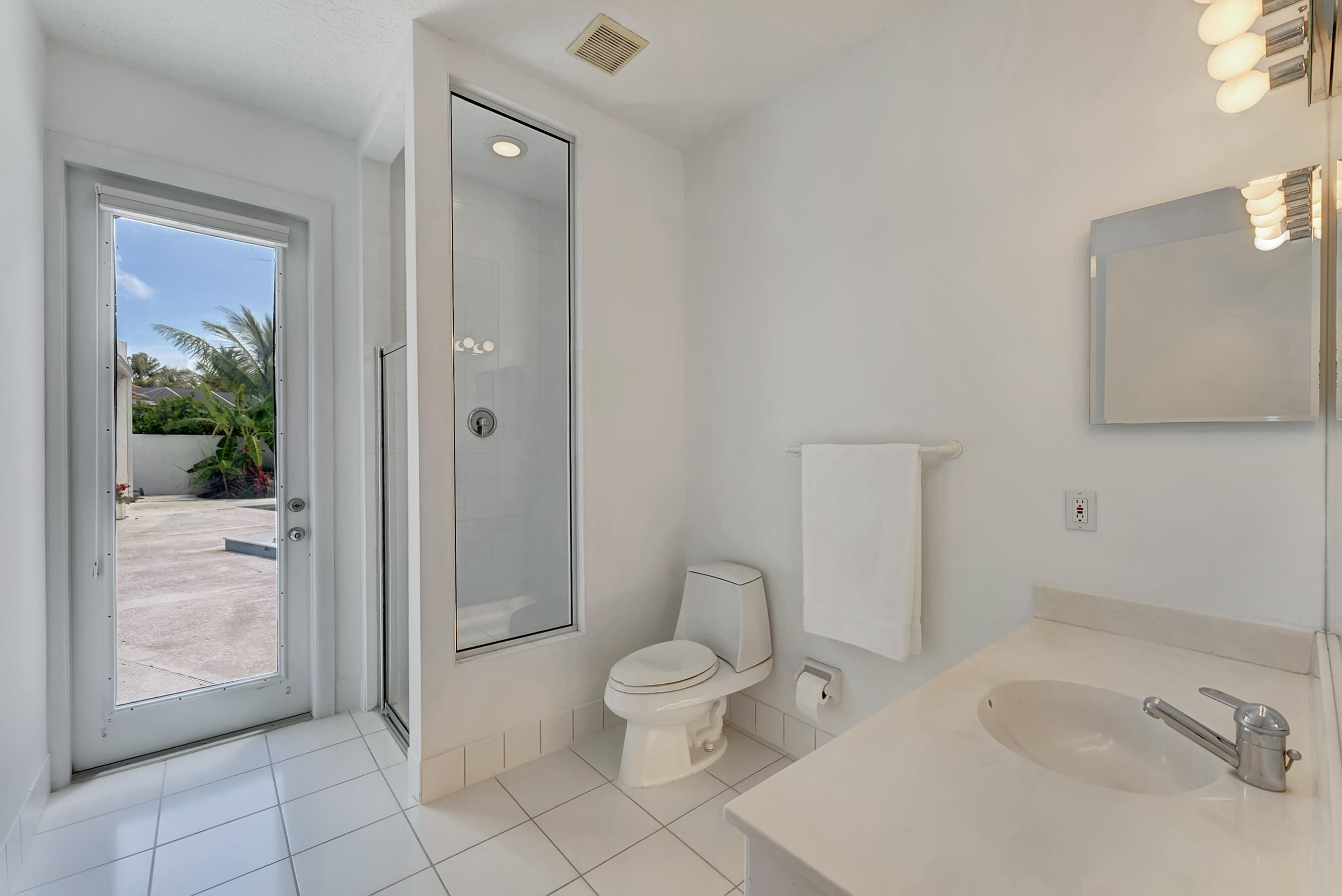 114 Olympus Circle Jupiter, FL 33477 - Photo 44 of 88 a bathroom with a toilet a sink and shower