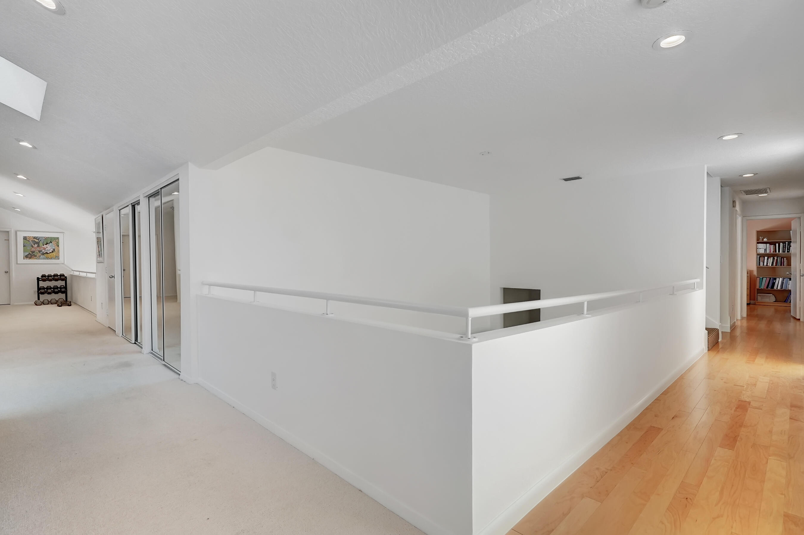 114 Olympus Circle Jupiter, FL 33477 - Photo 47 of 88 a view of a hallway with wooden floor and entryway