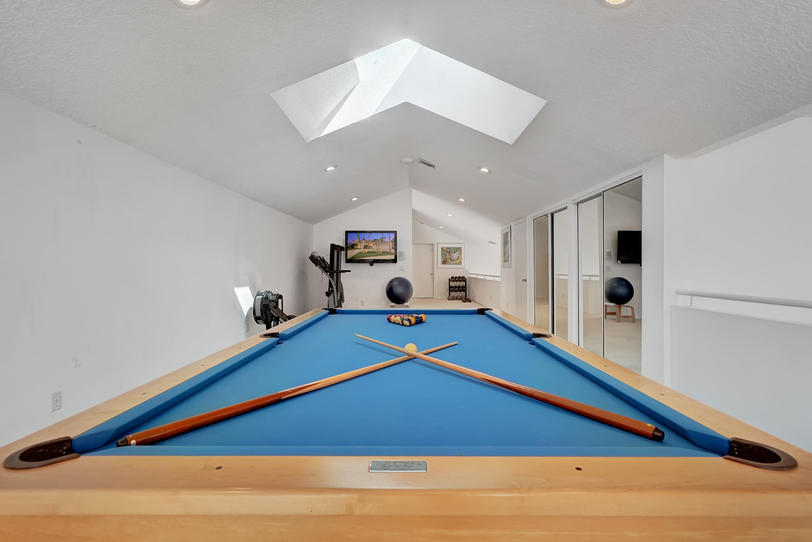 114 Olympus Circle Jupiter, FL 33477 - Photo 49 of 88 a room with pool table and lots of flat screen tv