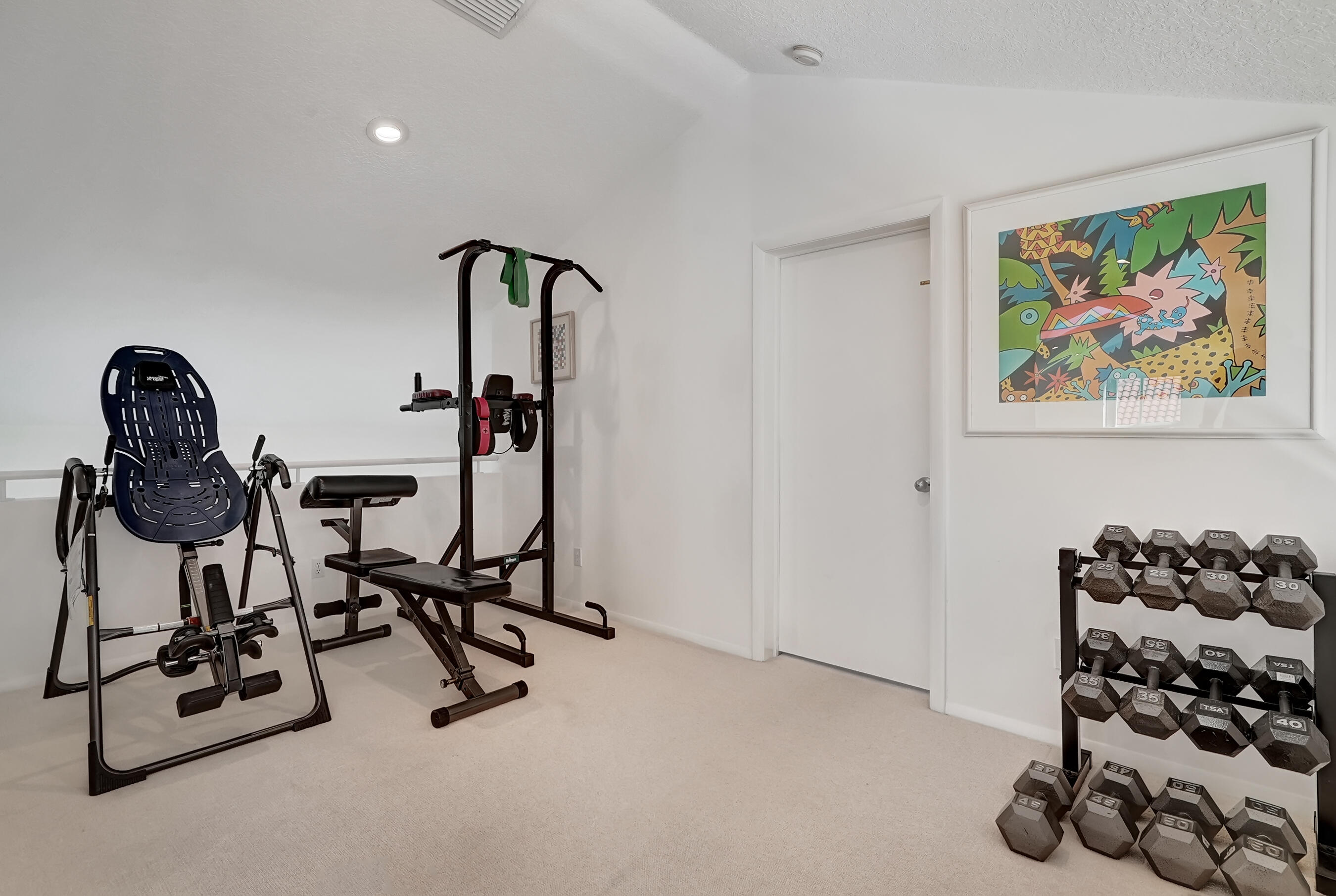 114 Olympus Circle Jupiter, FL 33477 - Photo 50 of 88 a view of a room with gym equipment