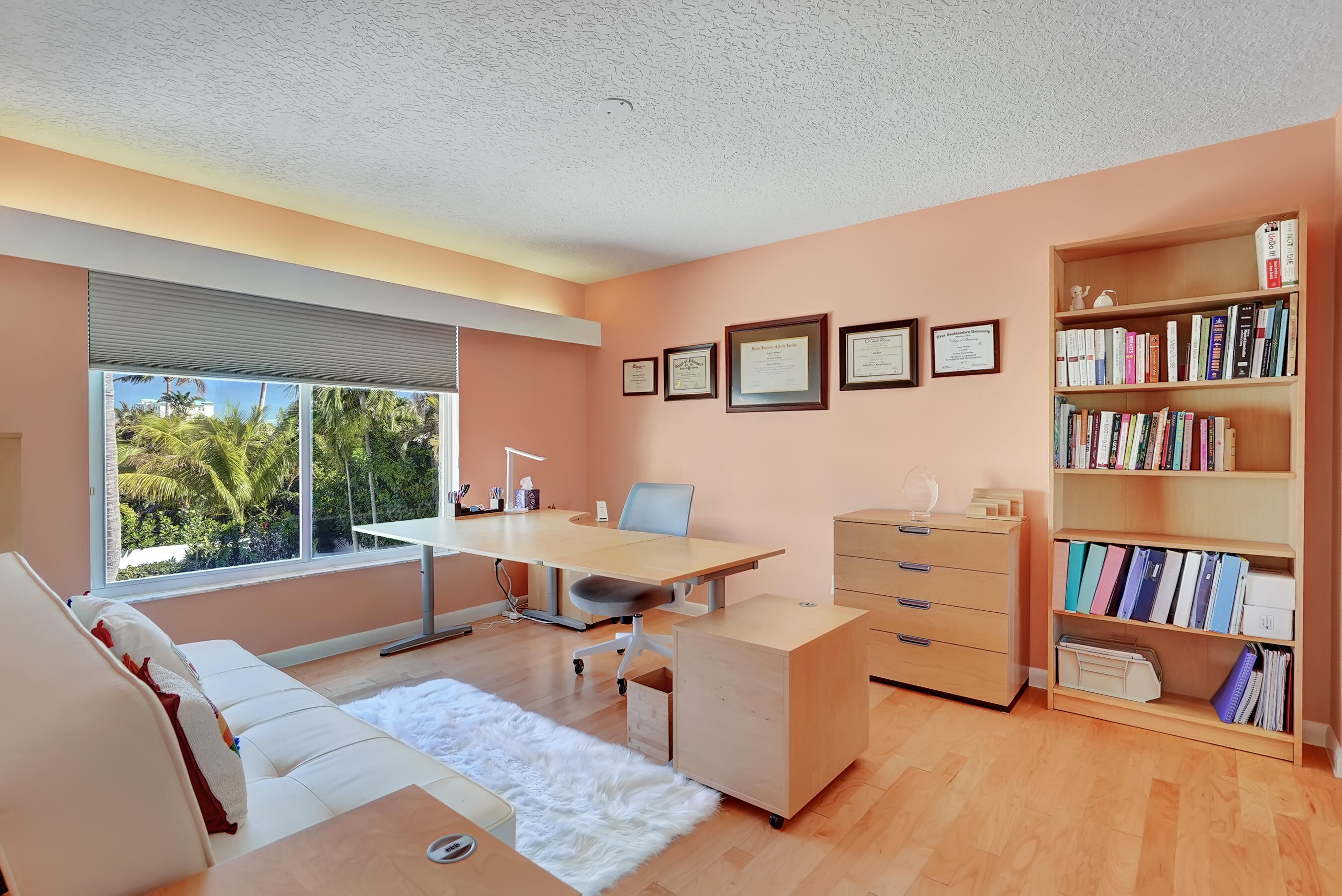 114 Olympus Circle Jupiter, FL 33477 - Photo 56 of 88 a work room with furniture and a book shelf