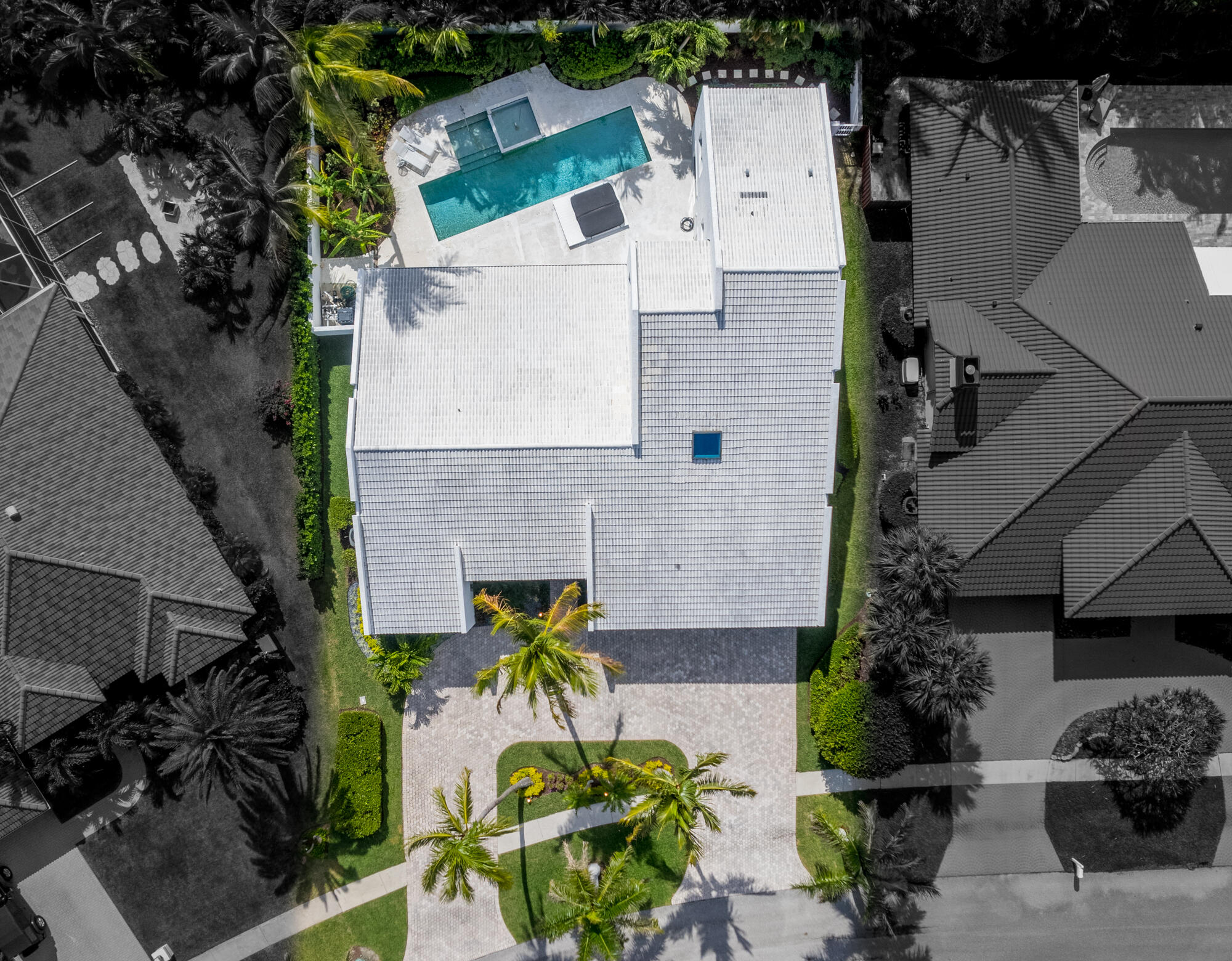 114 Olympus Circle Jupiter, FL 33477 - Photo 62 of 88 an aerial view of a house with swimming pool and outdoor seating