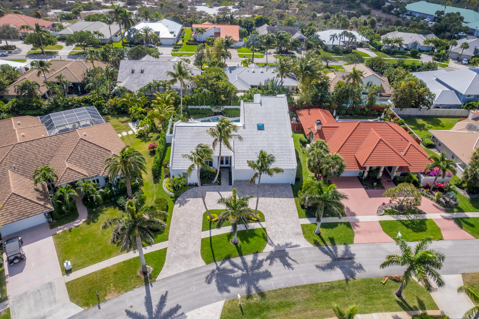 114 Olympus Circle Jupiter, FL 33477 - Photo 64 of 88 an aerial view of residential house with outdoor space and swimming pool