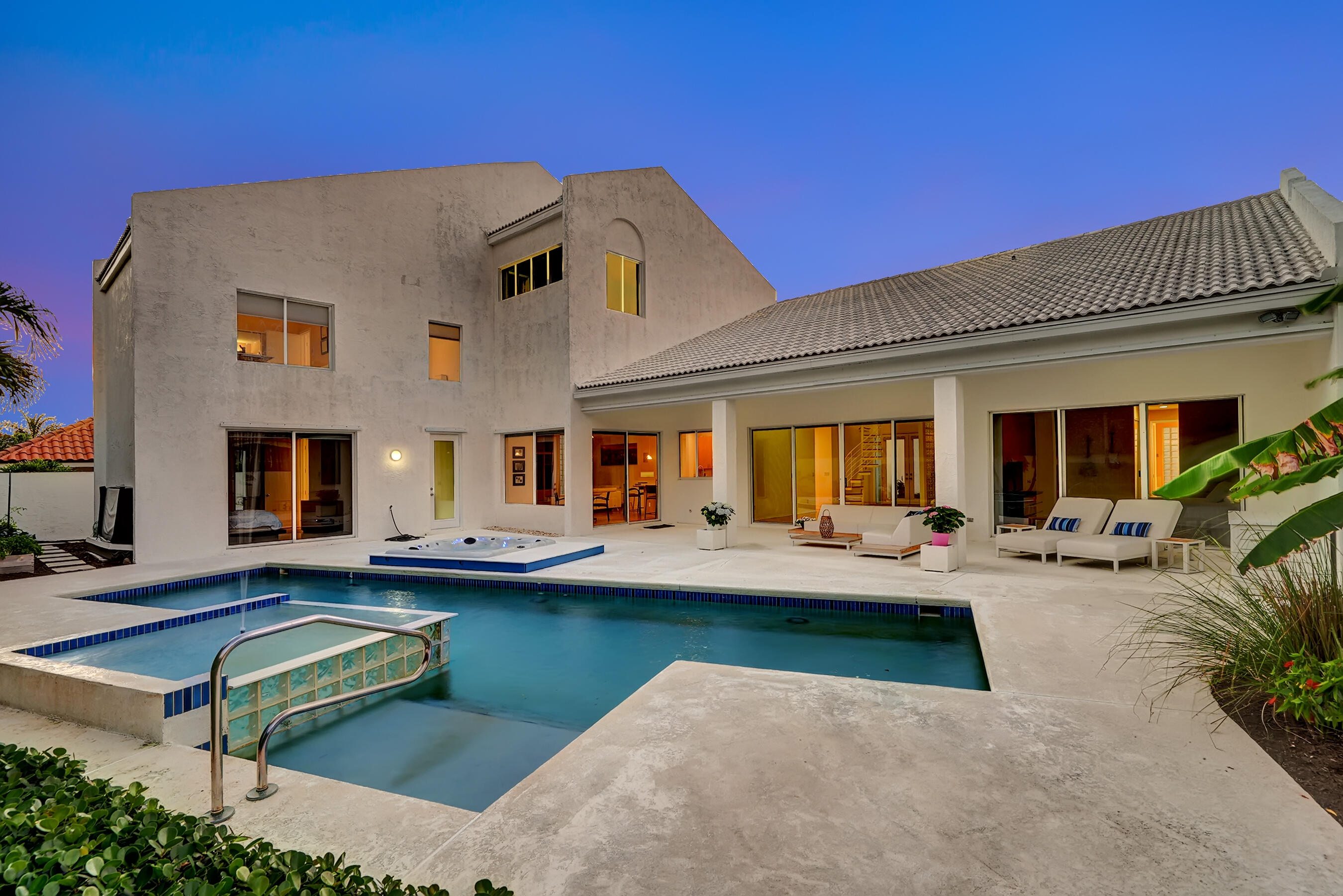 114 Olympus Circle Jupiter, FL 33477 - Photo 66 of 88 a view of a house with swimming pool and sitting area