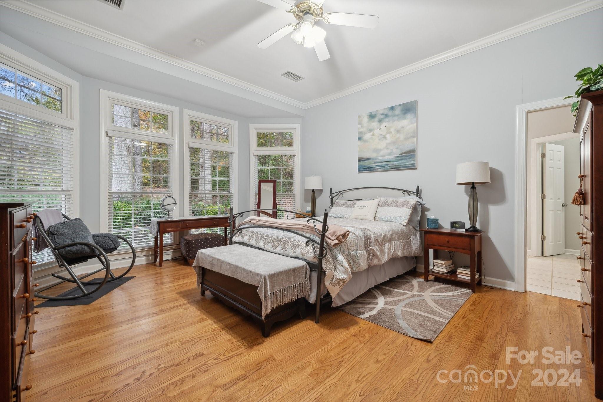 8610 Brentfield Road Huntersville, NC 28078 - Photo 20 of 48 a spacious bedroom with a bed and a couch