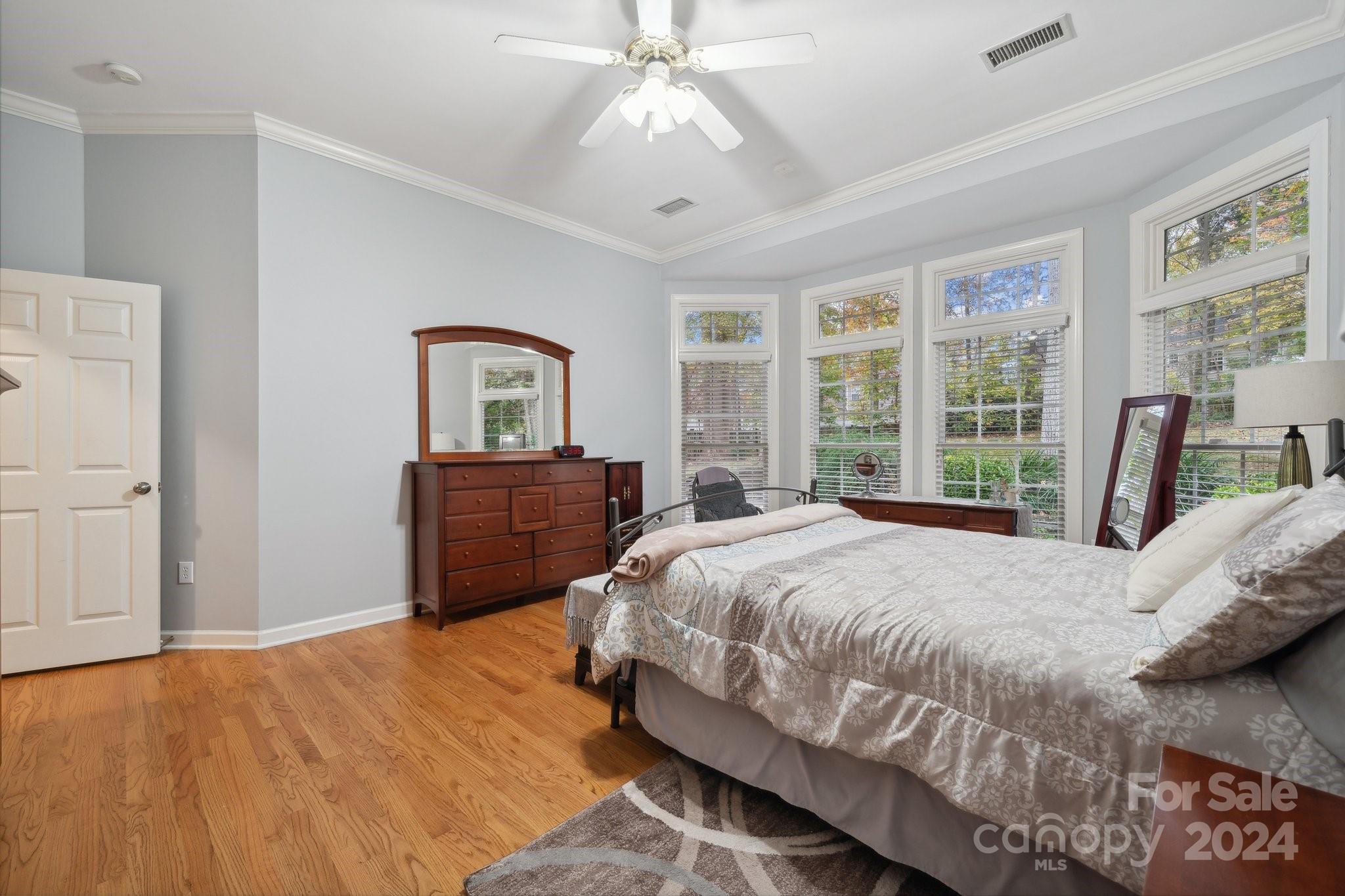 8610 Brentfield Road Huntersville, NC 28078 - Photo 21 of 48 a bedroom with a bed and a large window