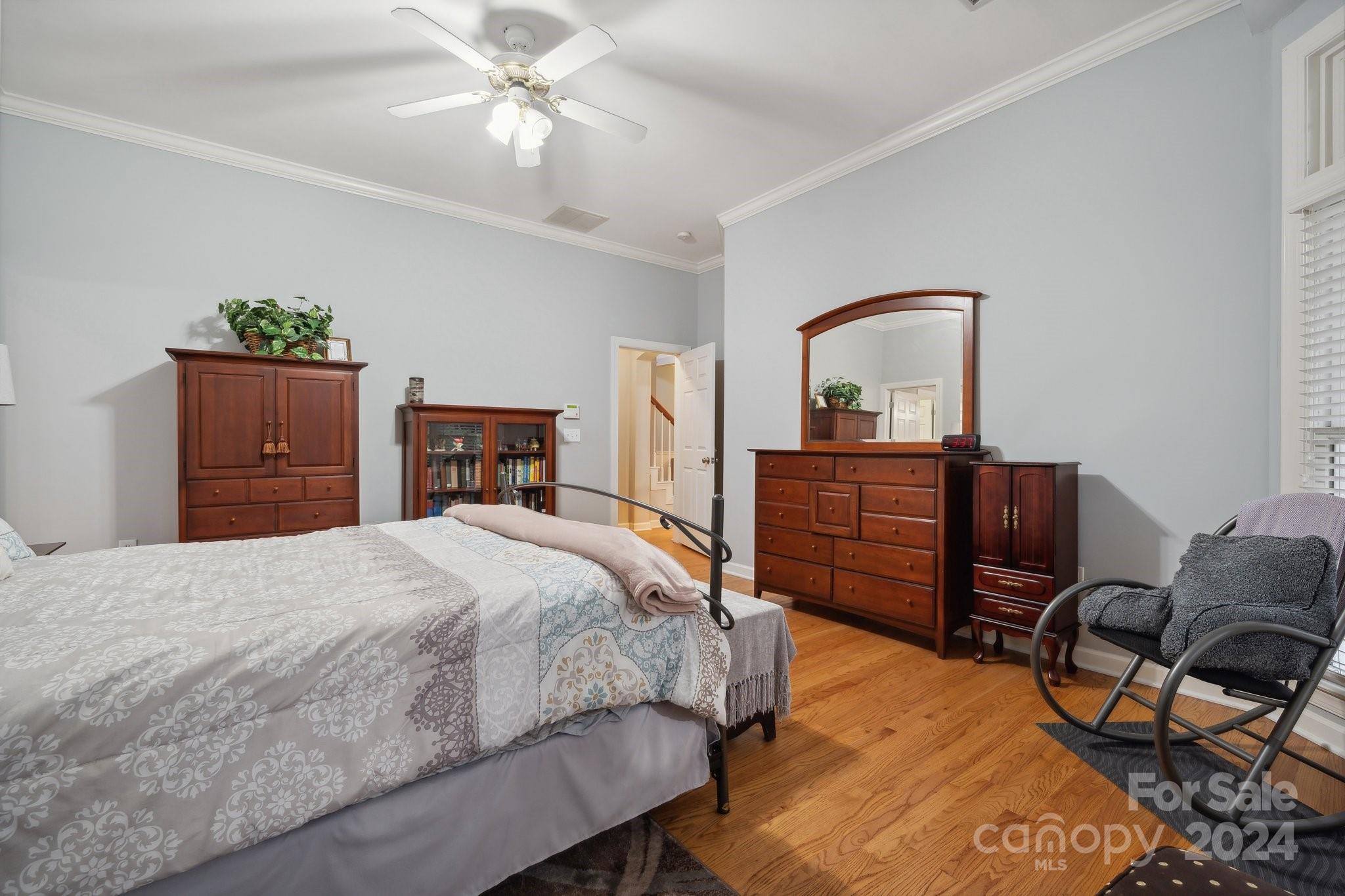 8610 Brentfield Road Huntersville, NC 28078 - Photo 22 of 48 a bedroom with a bed and dresser with mirror