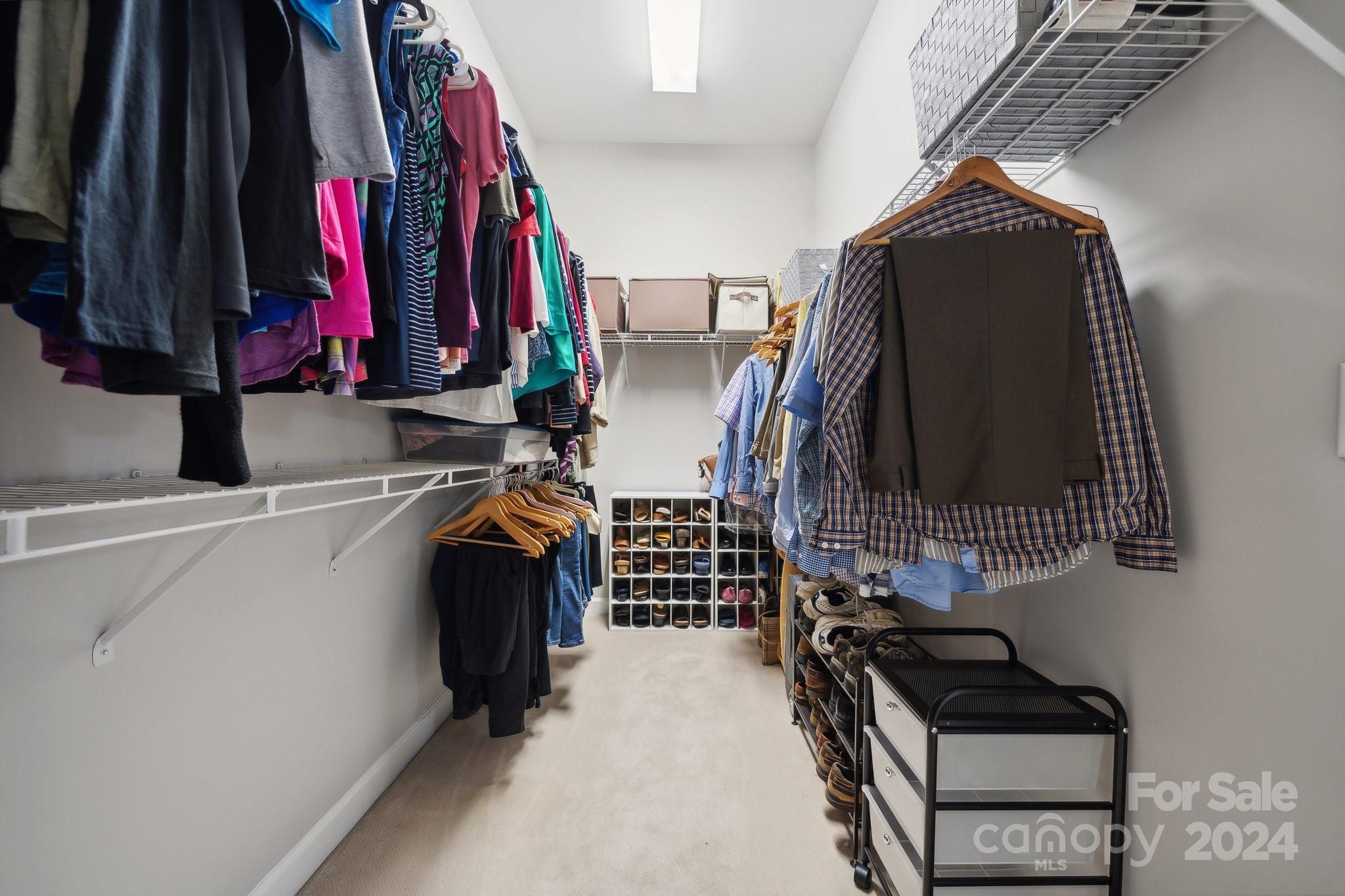 8610 Brentfield Road Huntersville, NC 28078 - Photo 26 of 48 a view of walk in closet with clothes and shoes