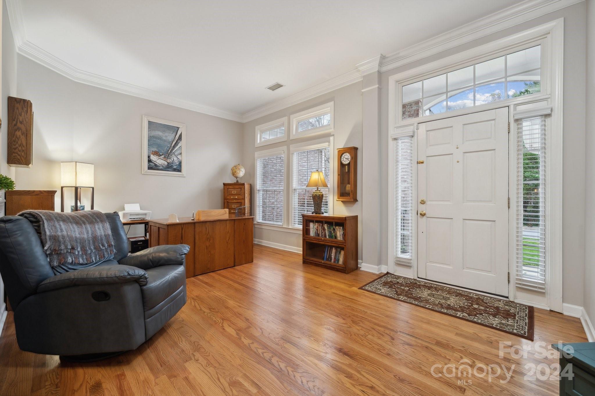 8610 Brentfield Road Huntersville, NC 28078 - Photo 3 of 48 a living room with furniture and a table