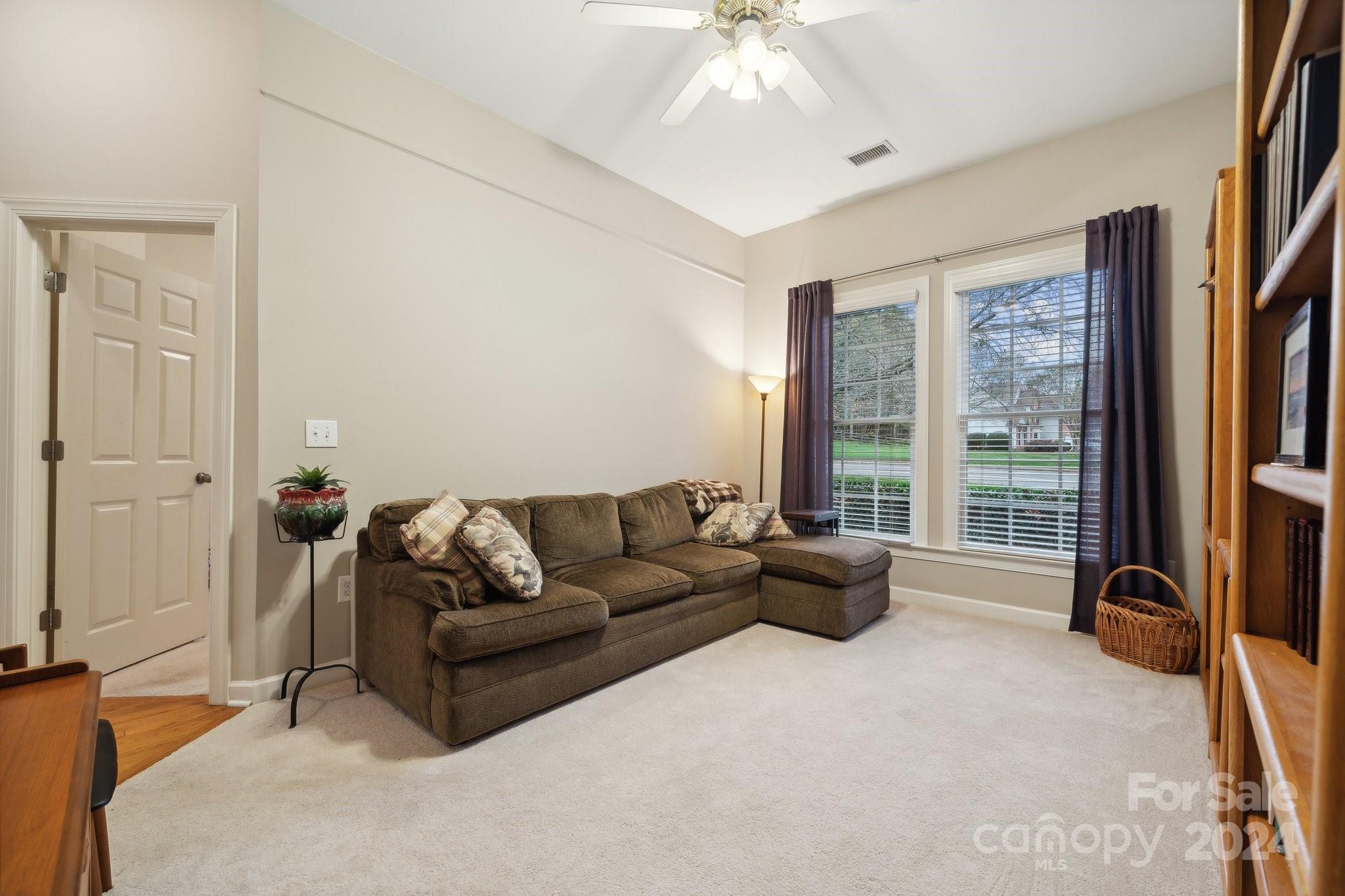 8610 Brentfield Road Huntersville, NC 28078 - Photo 31 of 48 a living room with furniture and a flat screen tv