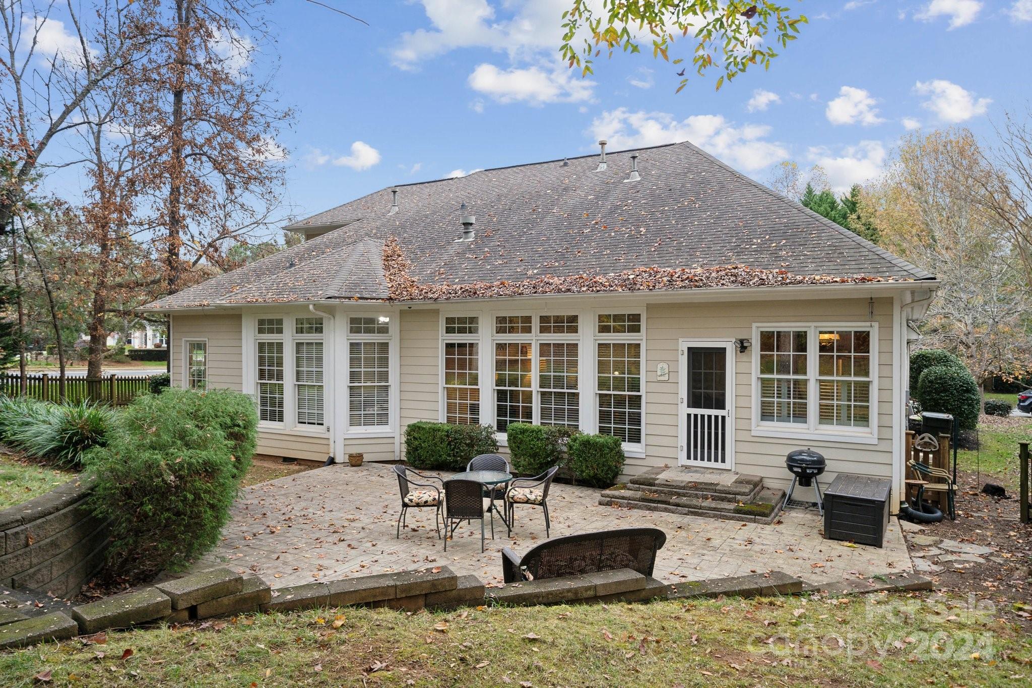 8610 Brentfield Road Huntersville, NC 28078 - Photo 36 of 48 a view of a house with patio furniture and potted plants