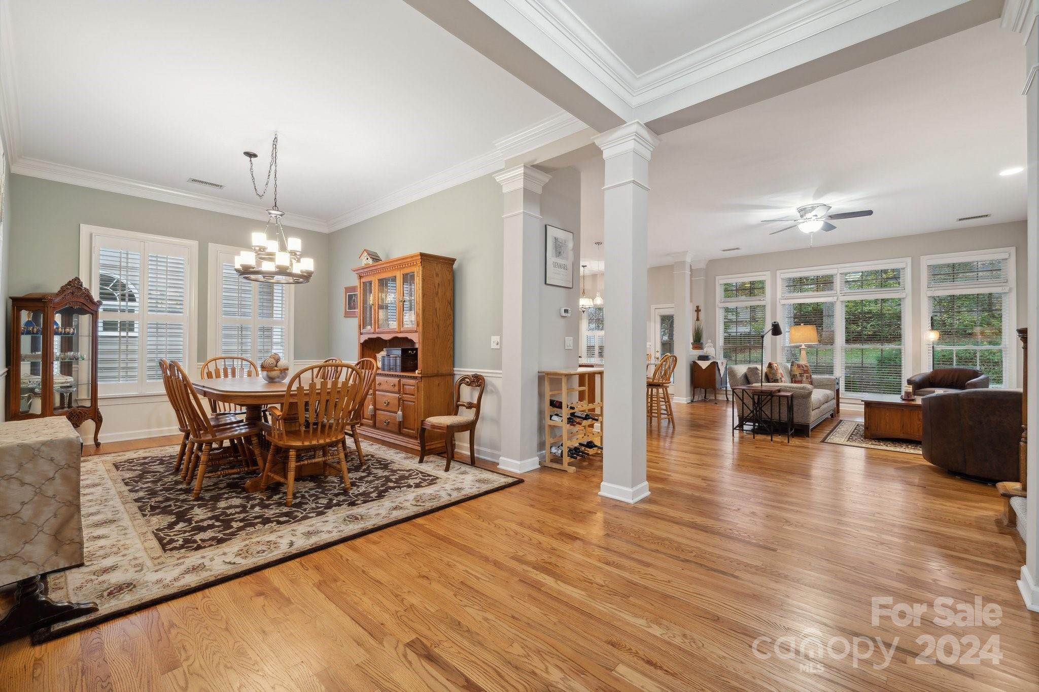 8610 Brentfield Road Huntersville, NC 28078 - Photo 6 of 48 a view of a dining room with furniture window and wooden floor