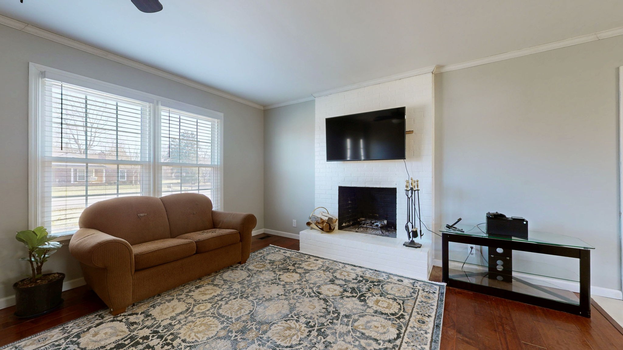 633 Buck Lane Murfreesboro, TN 37129 - Photo 3 of 16 a living room with furniture a flat screen tv and a fireplace