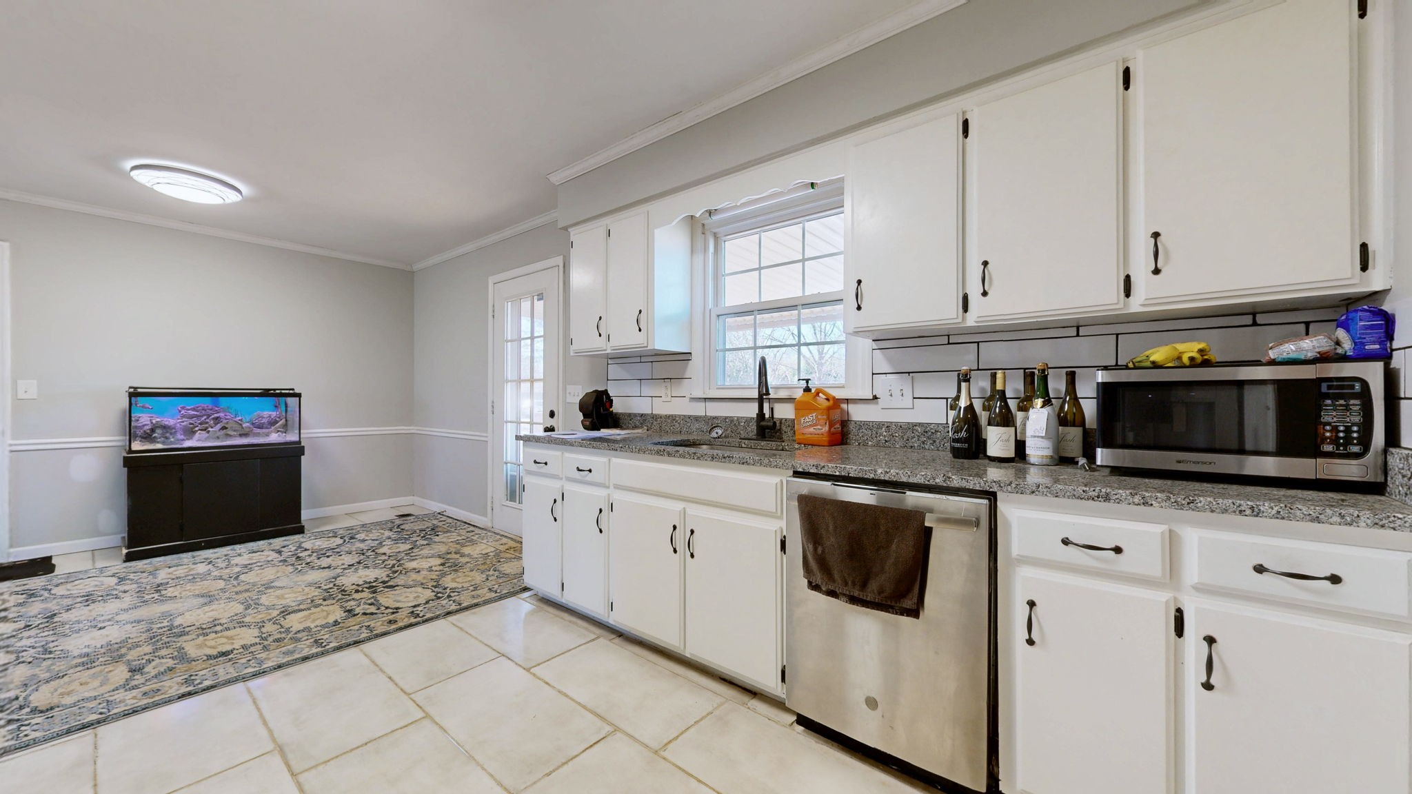 633 Buck Lane Murfreesboro, TN 37129 - Photo 4 of 16 a kitchen with granite countertop white cabinets and stainless steel appliances