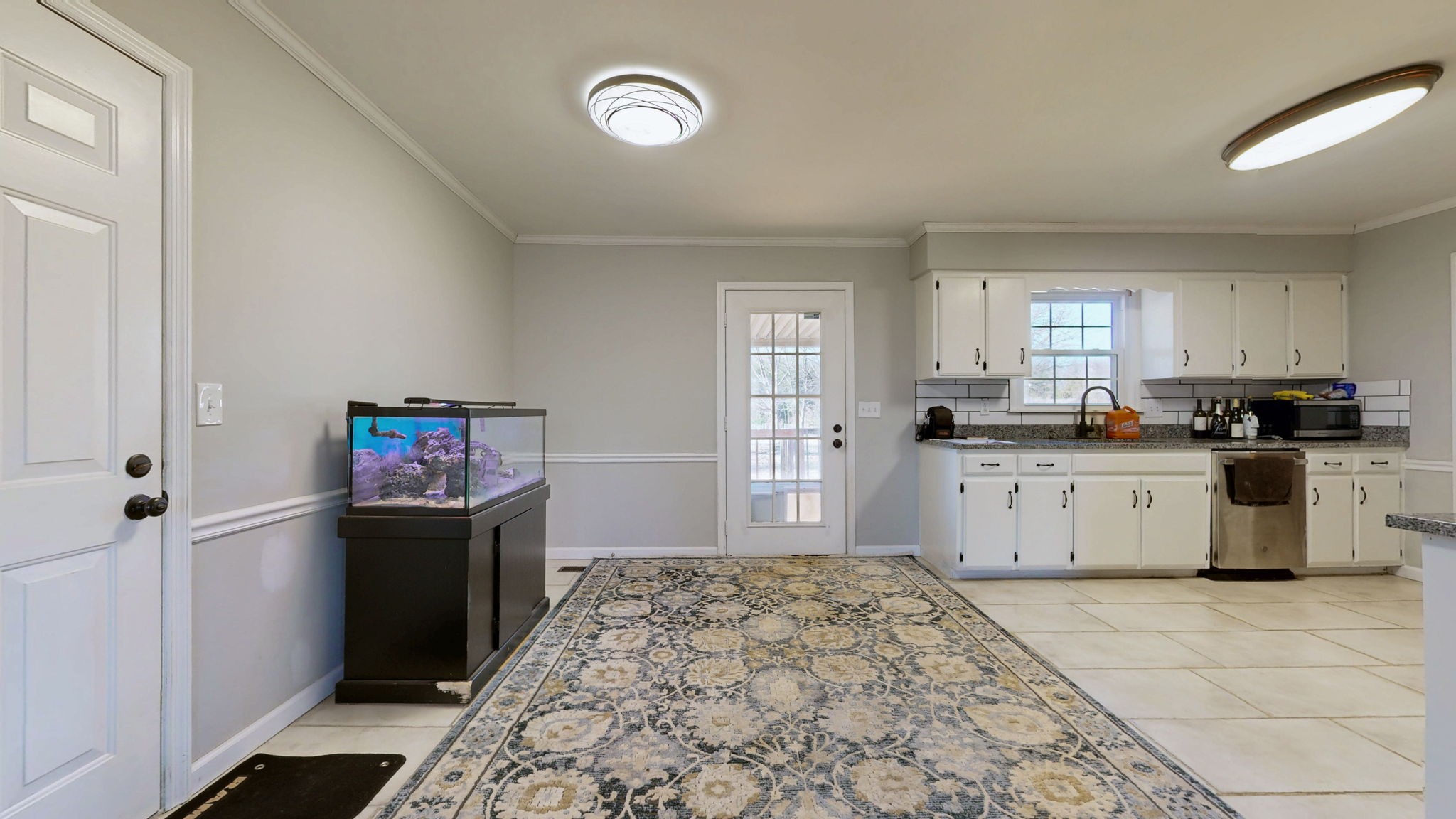 633 Buck Lane Murfreesboro, TN 37129 - Photo 5 of 16 a kitchen with granite countertop a refrigerator stove top oven and cabinets
