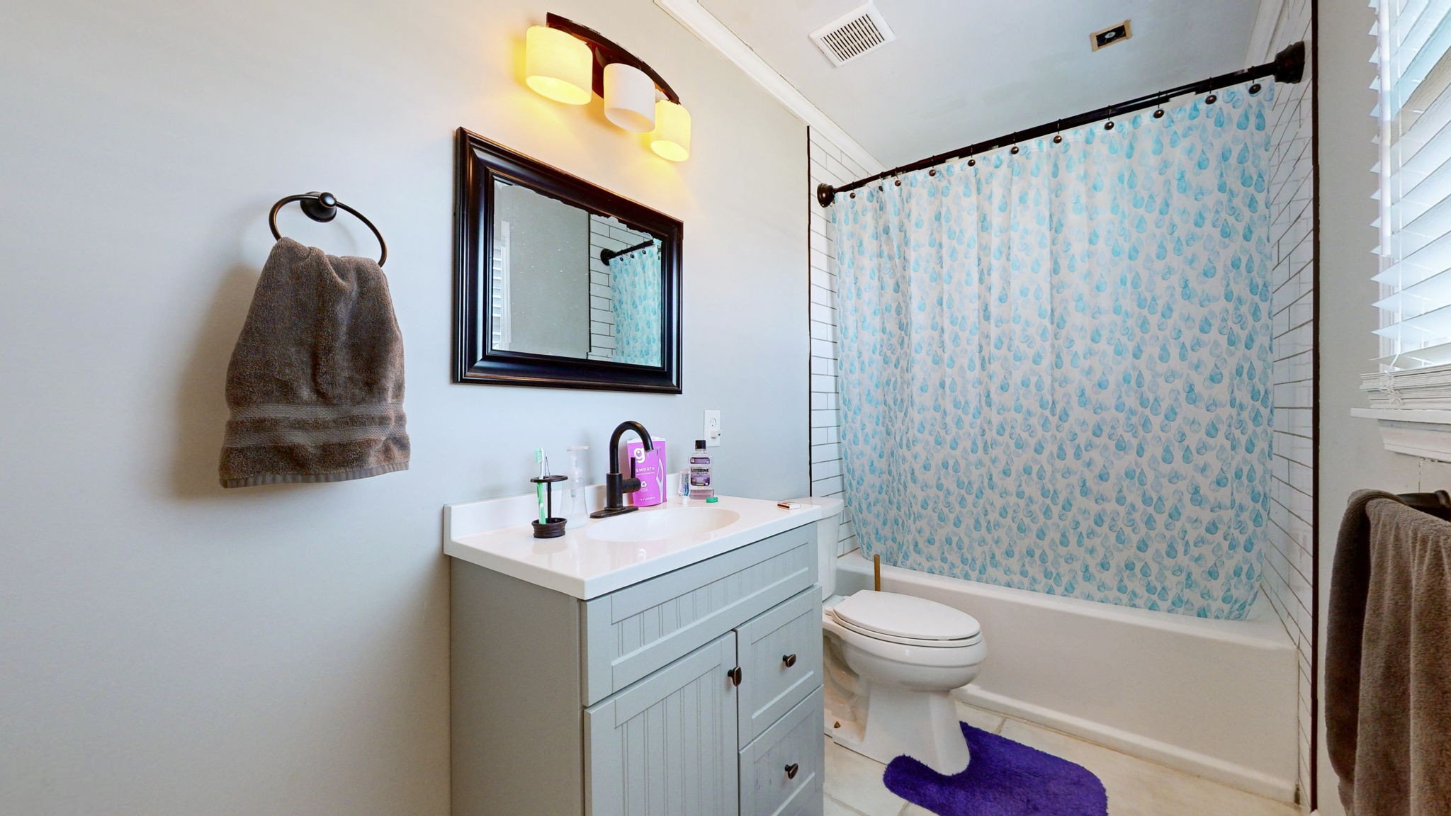 633 Buck Lane Murfreesboro, TN 37129 - Photo 8 of 16 a bathroom with a toilet sink vanity tub and mirror