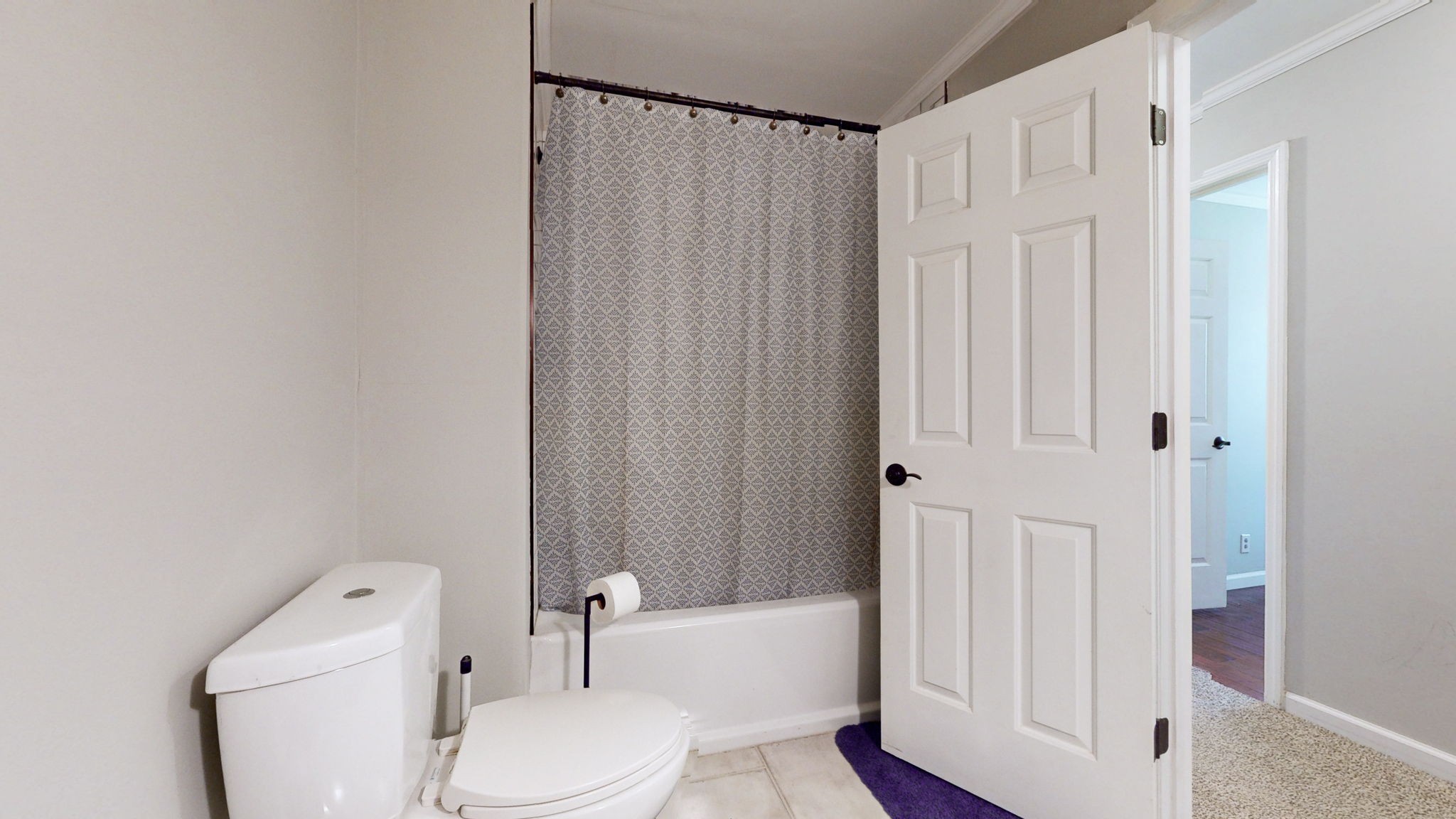 633 Buck Lane Murfreesboro, TN 37129 - Photo 9 of 16 a white toilet sitting next to a bathroom sink